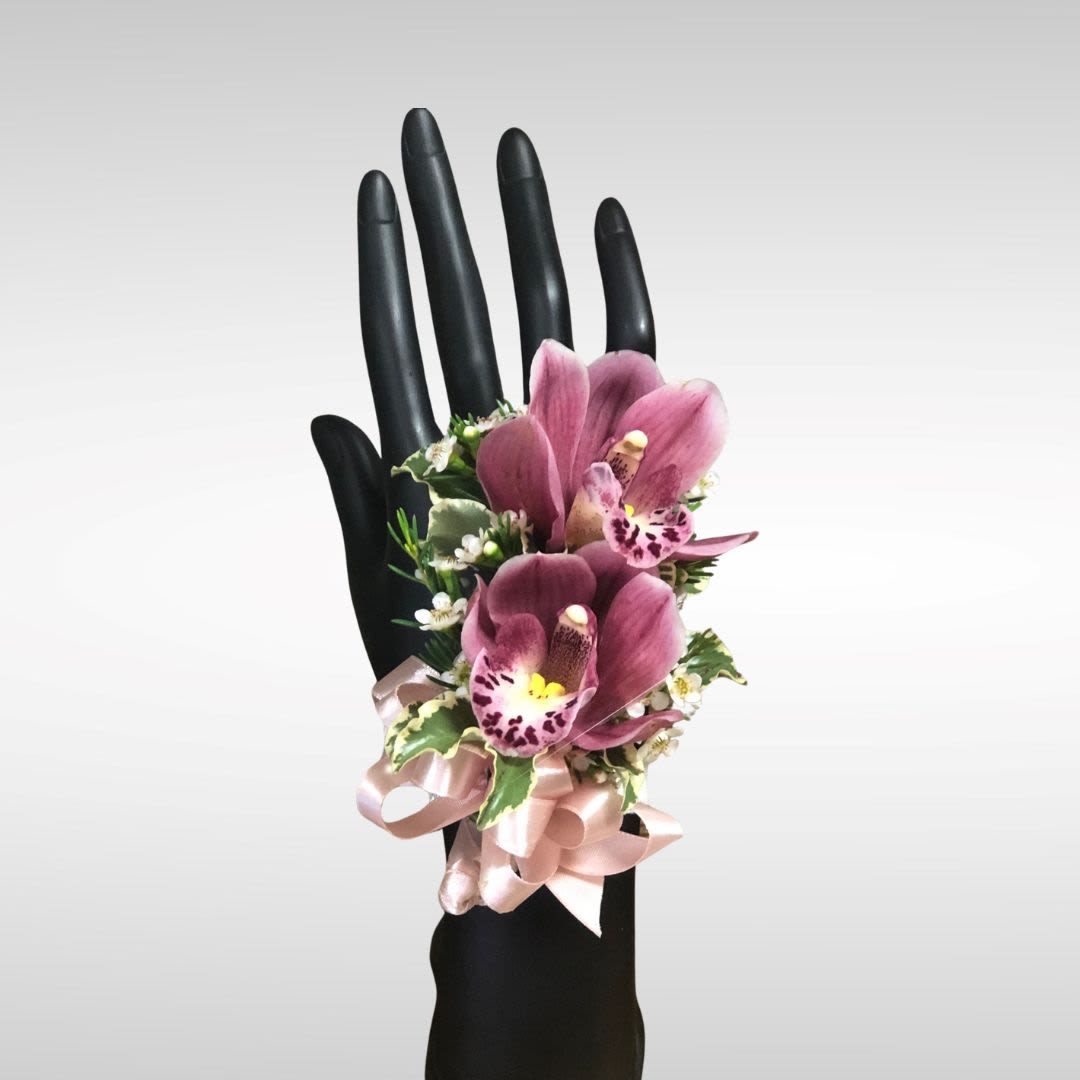 Cymbidium Orchids Boutonniere and Corsage - Boutonniere and Corsage with cymbidium orchids. Cymdium Orchid colors available: pink/purple, white, yellow PLEASE READ BEFORE PURCHASE Please specify color rose and ribbon in special instructions during check out. You can send a picture of the color dress/ tux to our email with order number: flowerfinesse@yahoo.com Choice of Pearl, Crystals, Feather, Glitter accents are available for extra charge. Boutonniere only purchase regular Corsage only purchase deluxe Boutonniere and corsage set premium. Pick up only available. 