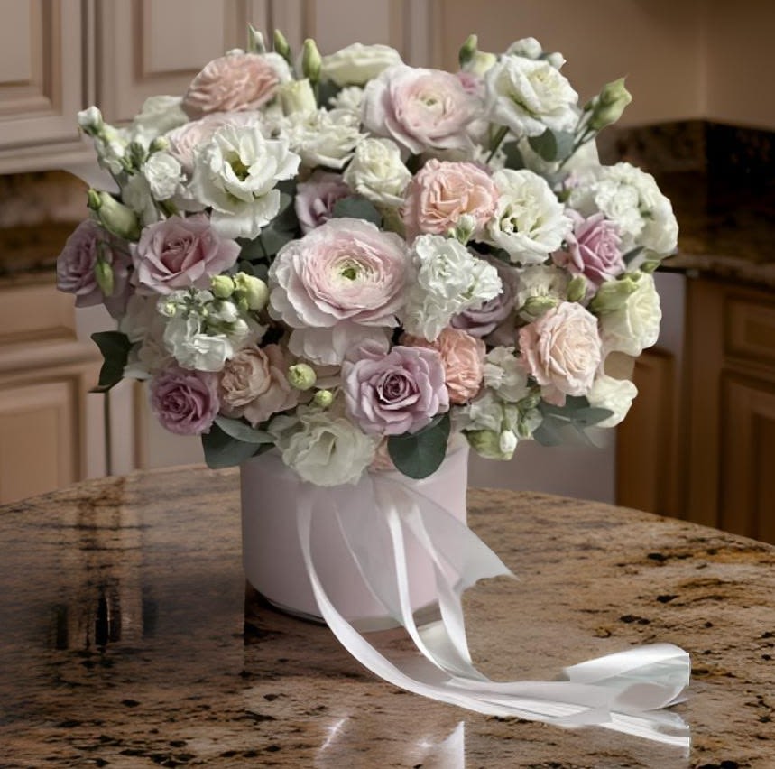 Elegant Romance  - Experience the beauty of our Elegant Romance Box, a stunning floral arrangement that combines the delicate charm of ranunculus, the timeless elegance of roses, and the graceful allure of Eustoma. Each bloom is meticulously arranged in a luxurious box, creating a captivating display perfect for any occasion. Whether you're celebrating a special moment or simply want to brighten someone's day, this arrangement is designed to impress. With its soft color palette and exquisite fragrance, our Elegant Romance will bring joy and sophistication to any setting. Enjoy same-day delivery for a fresh and beautiful gift that speaks volumes.