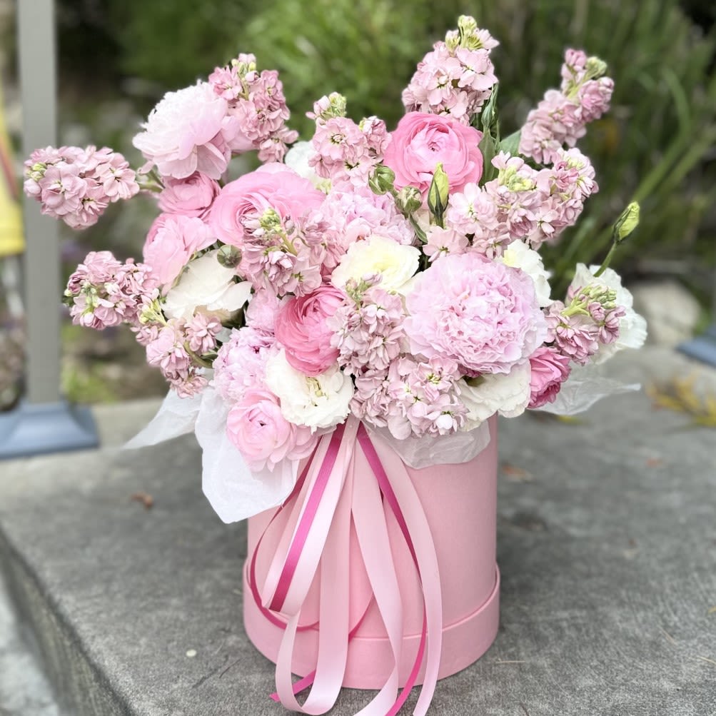Flower arrangement &quot;Rosy Romance&quot; - Delight in the elegance of a flower arrangement featuring ranunculus, lisianthus, roses, and stock in a luxurious pink and white palette. Carefully arranged in a stylish box, this composition radiates charm and sophistication. Perfect for any special occasion or to express your love and appreciation, this flower box offers a touch of modern beauty that will leave a lasting impression. Available for delivery in Los Angeles, it’s a gift that speaks from the heart.