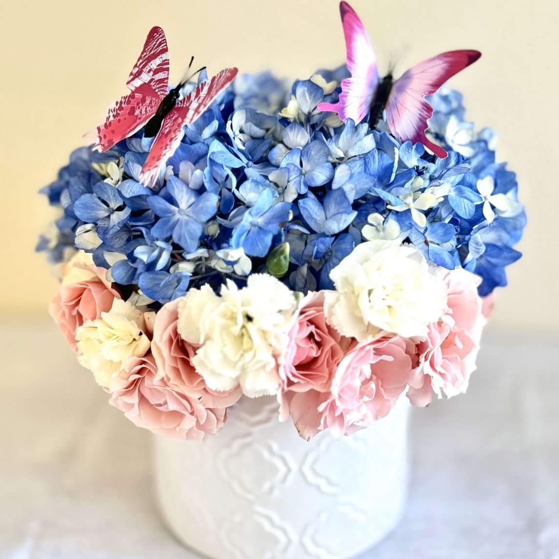 Holiday Flowers - This elegant bouquet combines soft blue Hydrangea, pink and white roses, making it perfect for interior decor or as a thoughtful gift for any occasion. The delicate arrangement, enhanced with decorative elements, adds a sense of freshness and comfort. With our flower delivery in Los Angeles, you can surprise your loved ones with unique floral designs that brighten any space.  Order this bouquet today and bring beauty and joy to your home or someone special!