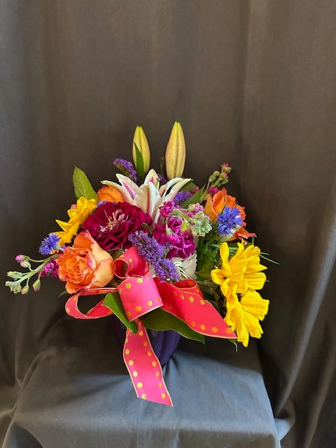  Large Mixed Bubble Bowl  - This arrangement will feature an assortment of seasonal flowers in a variety of bright cheerful colors. It will work for just about any occasion and is made short and pave on top of a container.