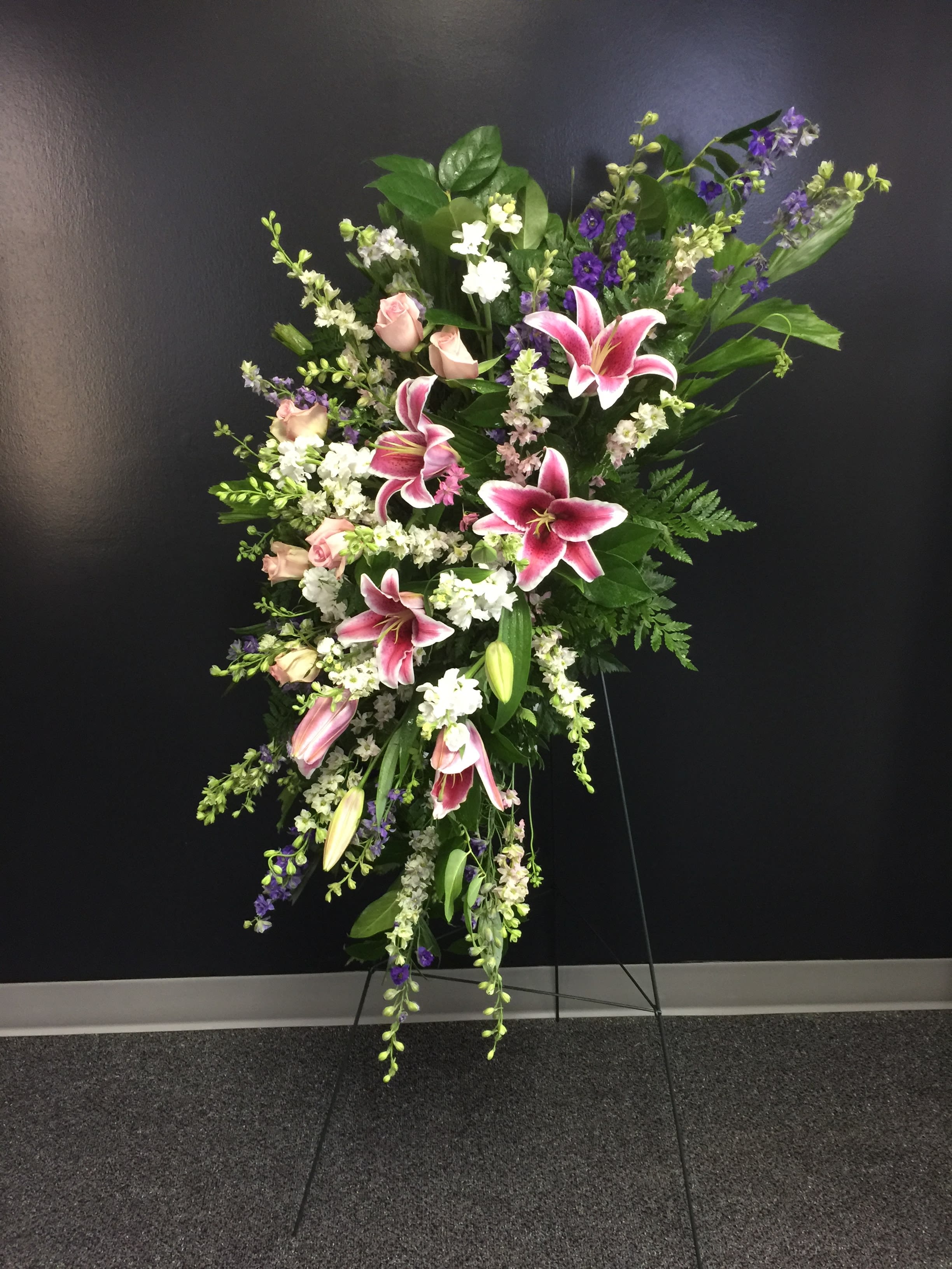 Sweet Farewell Spray - Purple, Pink and White Larkspur and lilies create this modern sympathy spray. All flowers may be substituted due to seasonal availability.