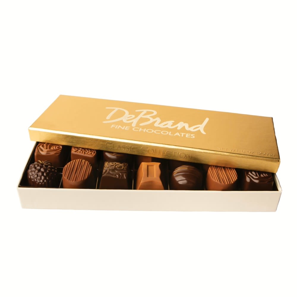 Add-On; DeBrand 14 pc Classic Collection Box (40% OFF) - ***SHORT TIME ONLY: 40% OFF*** Originally $31.50  14 pc Classic Collection Box Gluten Friendly Timeless favorites make up our most popular collection including luscious caramel variations, pure fruit creams bursting with wonderfully intense flavors, as well as other unusual and traditional varieties! Café Latte Chocolate Silk European Heart Gourmet PBJ Orange Cream Raspberry Cream - Milk Raspberry Cream - Dark Rose Carmella - Milk Rose Carmella - Dark Salted Peanut Butter Strawberry Rhubarb Caramel Toffee Crush Vanilla Buttercream  This item is available as an add-on item only and must be ordered in conjunction with any other product on our website to meet the $55 order minimum for delivery. Otherwise, it is pick-up only.  Please note that cancellations are subject to a 10% processing fee, or up to $25 for all refunds processed.