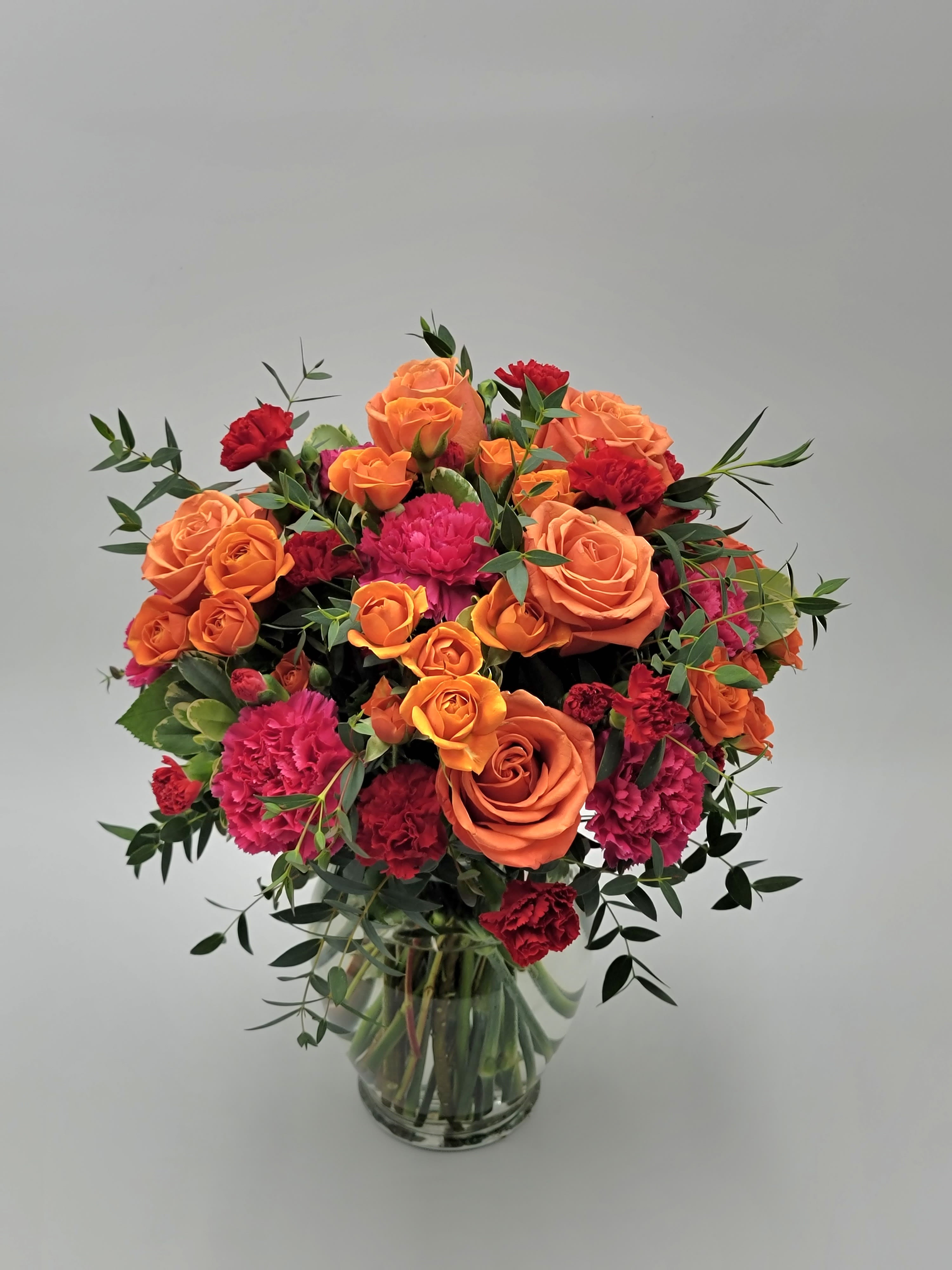 How Sweet It Is How Sweet It Is - Choose this very sweet and vibrant all-around arrangement to send today! Filled with roses, spray roses, carnations, and mini carnations. Approximately 11" tall by 10.5" wide.