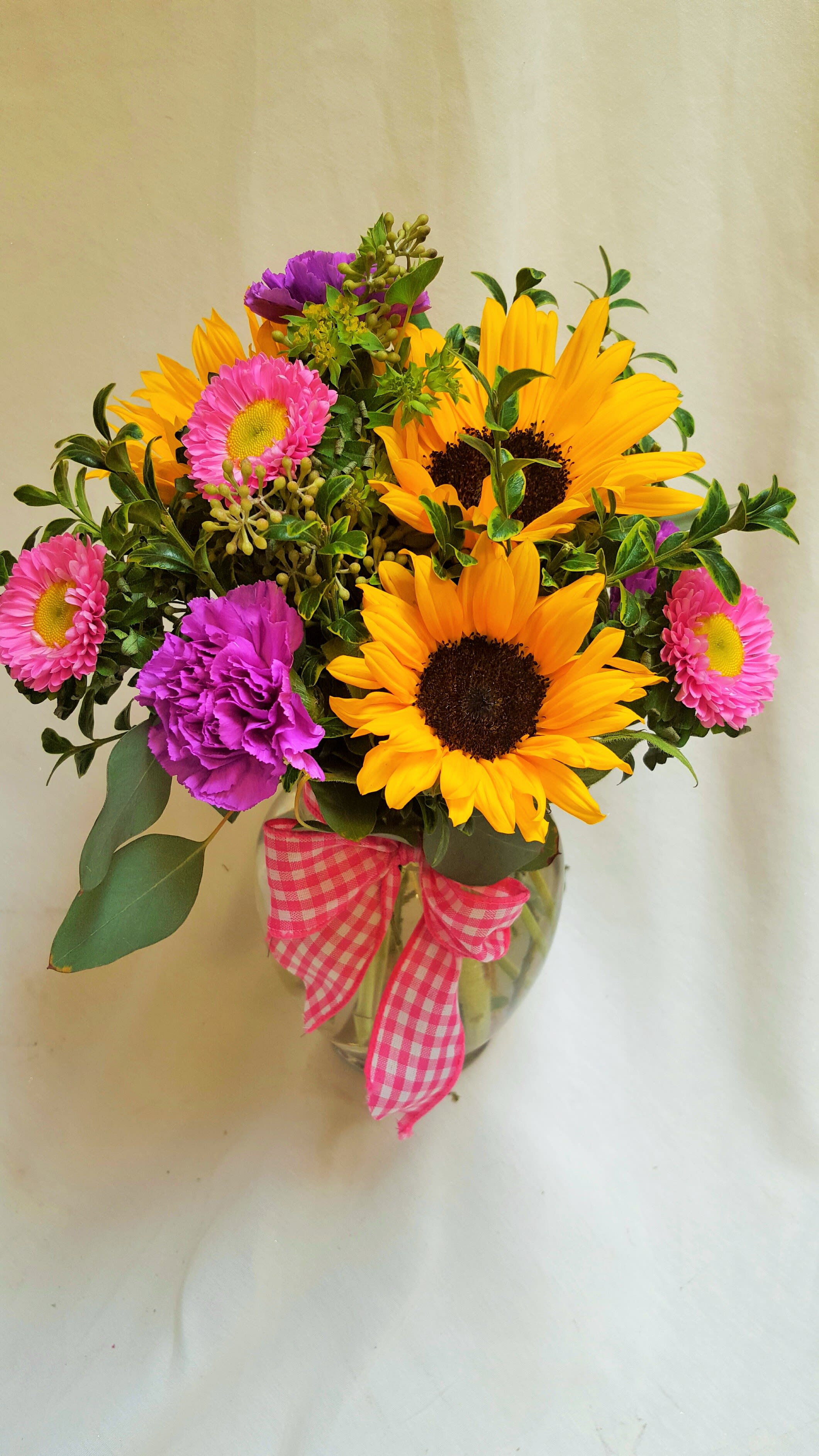 Sunny Summer Medley Sunny Summer Medley - Select this bright bold medley of summer flowers. Summer flowers include sunflowers, asters and lavender carnations.