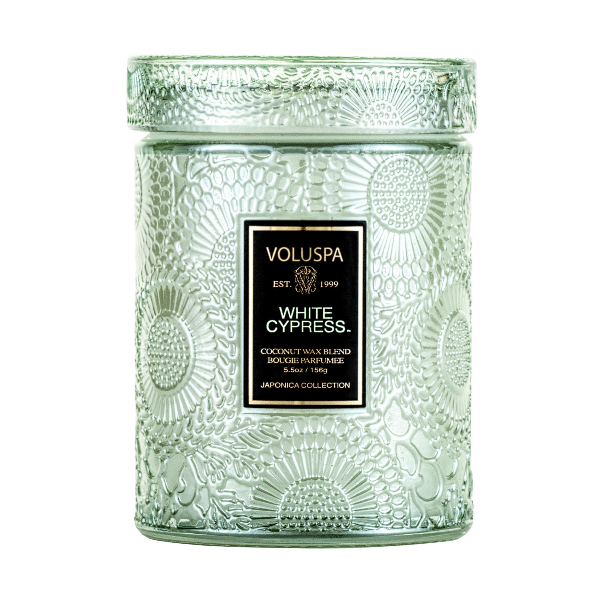 White Cypress - Small Jar Candle White Cypress - Small Jar Candle - DESCRIPTION Notes of White Cypress, Juniper Berry, Mint Leaves and Evergreen Wood. Fragrance Description White Cypress, a classic yet contemporary Holiday scent, captures a crisp walk in the winter woods. Frosted Bergamot and Minty Snowdrops perfectly envelop freshly cut Evergreen Cypress boughs and snow-kissed Sugar Plum. Bask in its glow while staying cozy inside. About the Product Voluspa's unique coconut wax blend is hand-poured into a 5.5 oz. glass embossed vessel and is topped with a matching lid that keeps the candle dust-free when not in use. The single wick allows you to enjoy fragrance throw for 50 hours. Our candles are hand-poured in the United States and feature our proprietary, clean-burning coconut wax blend and 100% natural wicks. Our products are free of phthalates, pesticides, parabens and sulfates and are never tested on animals. Up-cycle this best seller into a keepsake after the last burn.