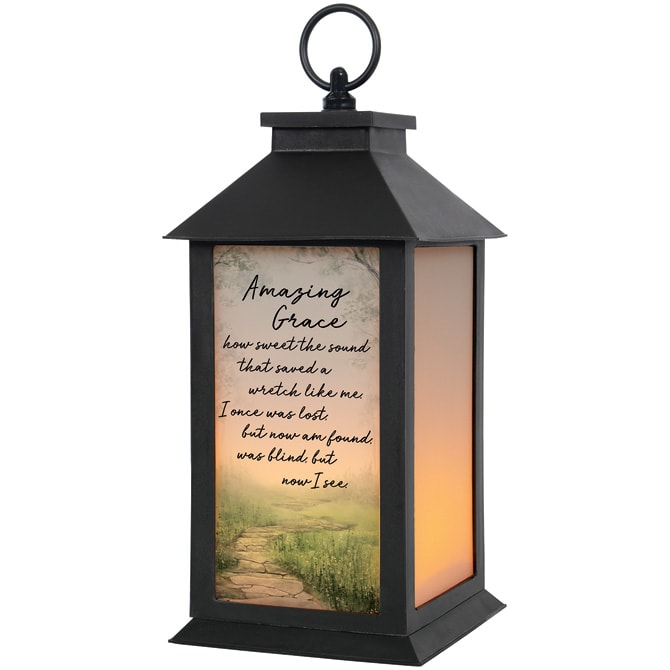 "Amazing Grace" Lantern "Amazing Grace" Lantern - These lanterns are made of weather friendly materials and UV printed frosted glass. They include a flameless LED candle with a built-in automatic timer: 6hrs They are suitable for hanging or free-standing use. W: 5.5" H: 13" D: 5.5"