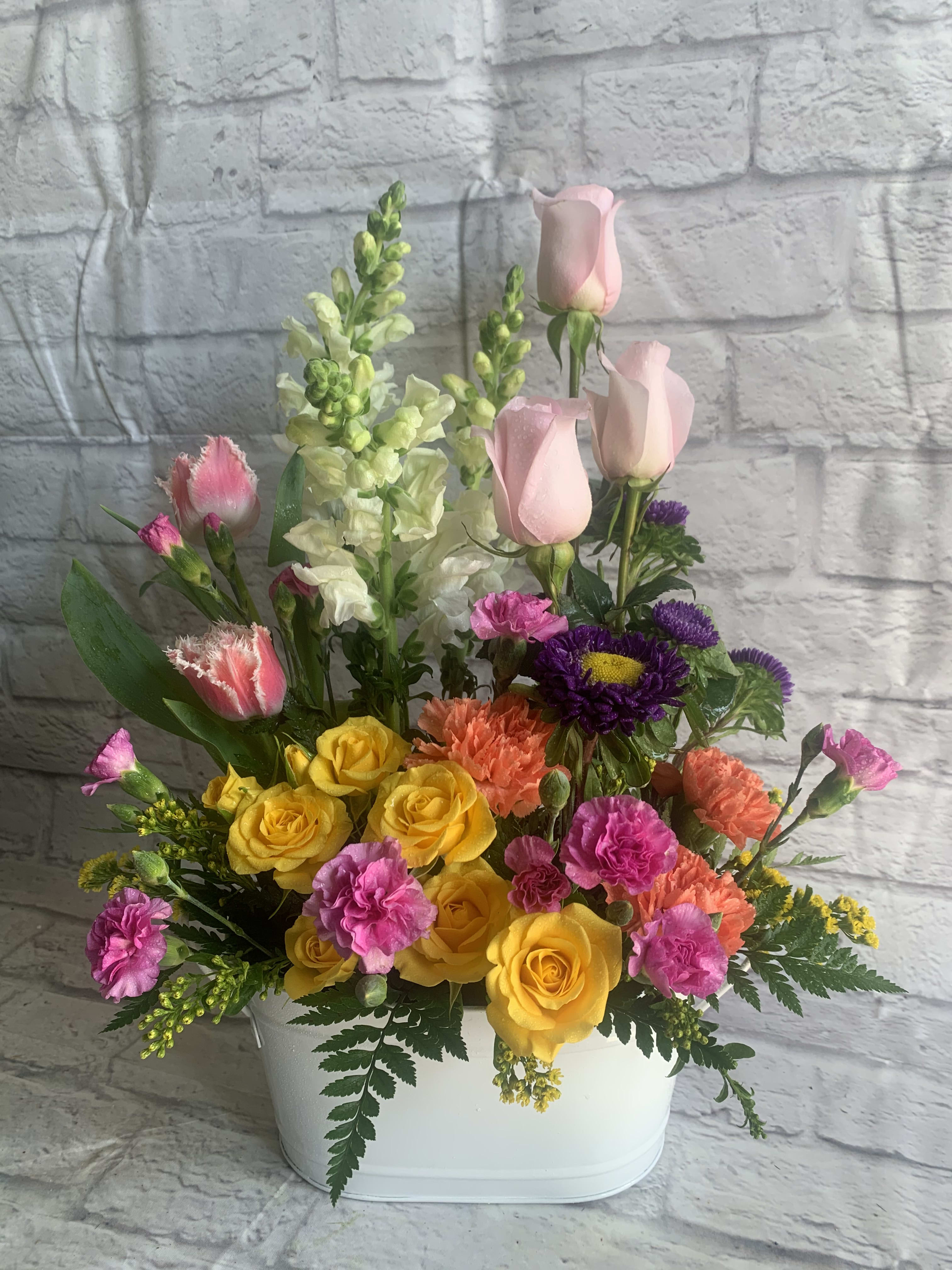A Tailored Garden A Tailored Garden - Soft colors, awesome blossoms and tantalizing textures arranged in a garden styled bouquet! (All designs are arranged as similar as possible. We promise to keep the same color, style, and overall theme with what Mother Nature generously blesses us with.)