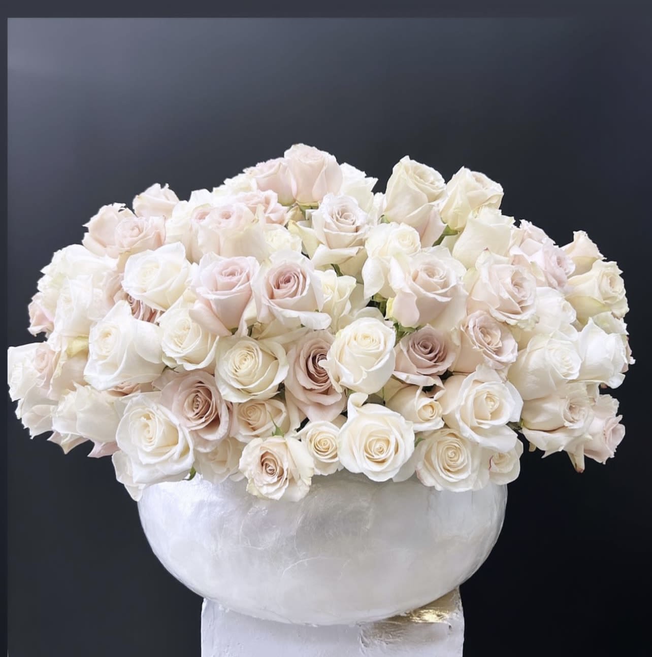 The Soft Touch The Soft Touch - Mix of blush and ivory roses, full and lush arrangement in gorgeous round vase. The creamy ivory hues and soft blush hues are the perfect complement and the most stunning soft pallet. Lovely for anyone who loves pure beauty. Some florals are seasonal, if particular flower will not be available due to season, we will substitute for similar flower, composition, color pallet and value of the arrangements as closely as possible. All effort to create a floral arrangement as close to the photo shown, the actual arrangement may vary slightly in its appearance from the photo shown. If you have any questions about your order, we welcome you to call us in or email