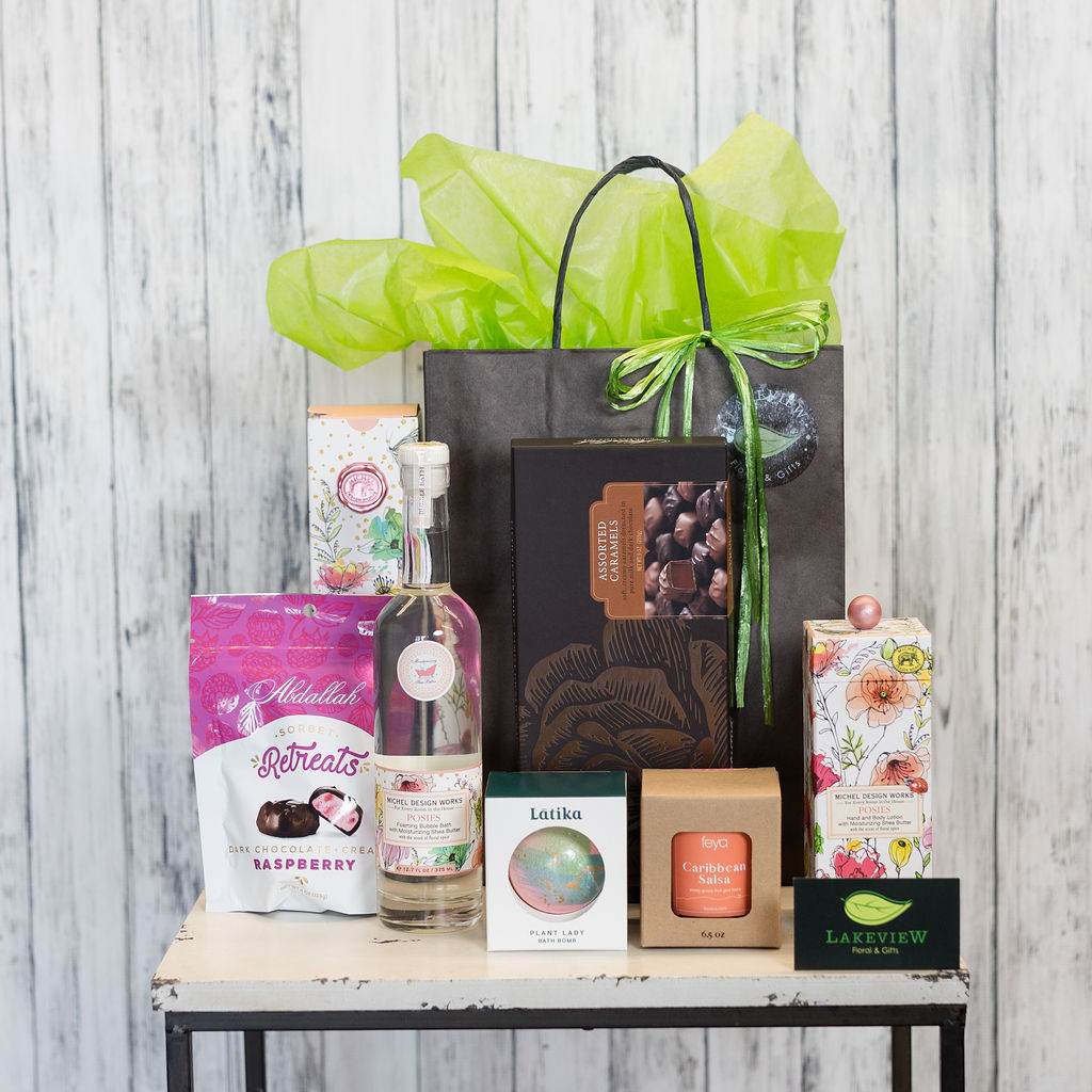 Indulge - Be the ultimate gift giver and shower someone with this fabulous treasure of delights from some of our favorite gift lines! This gift basket includes a box of delicious Abdallah chocolates, luxurious bath bombs, foaming bubble bath, moisturizing hand soap and a delightfully fragrant candle. A gift they soon won't forget!   Your gift is beautifully packaged in a deluxe gift bag with matching tissue.