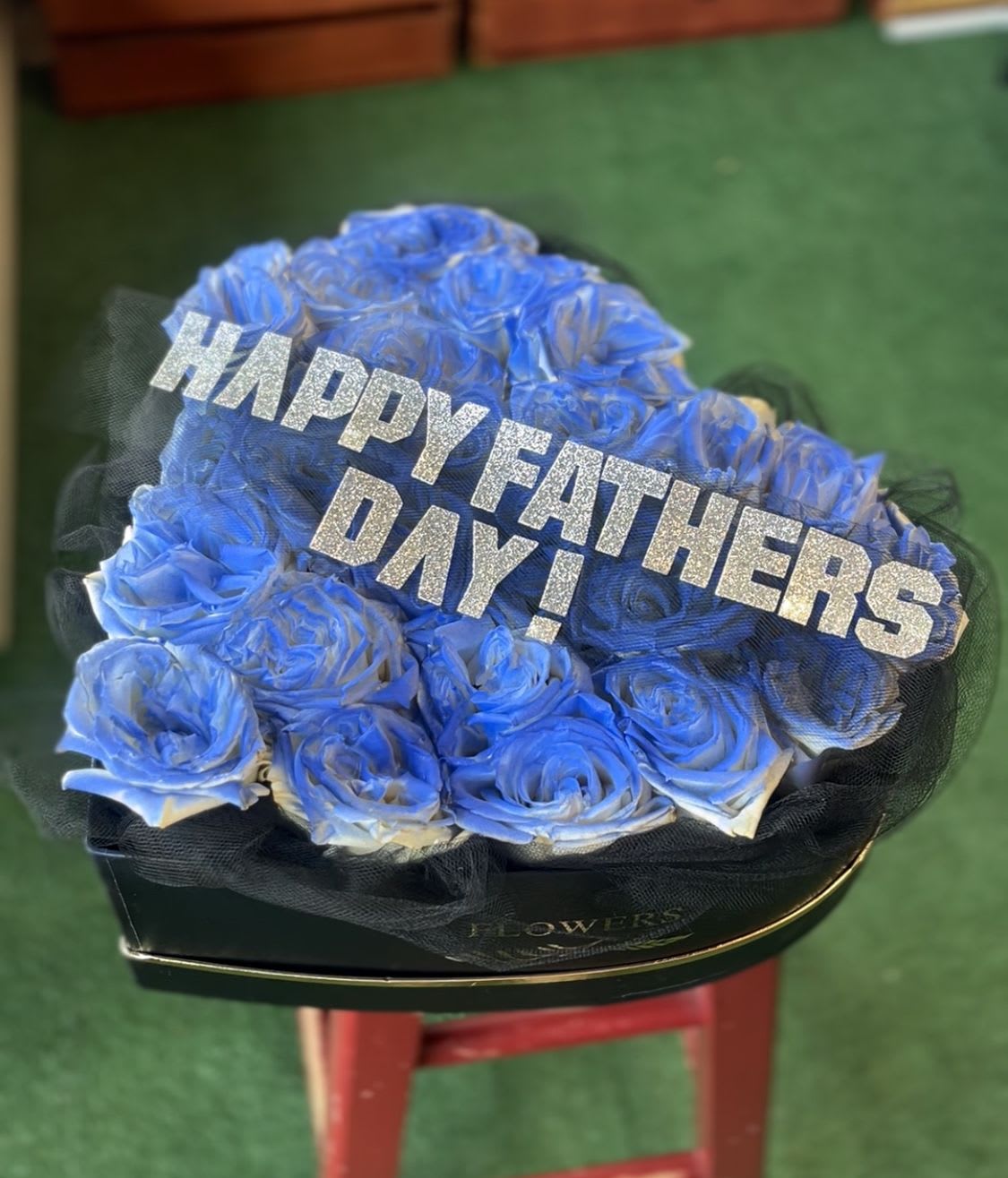 Father’s Day love box - Blue roses in a black box with a sash that saids “ happy Father’s Day” message may be customized 