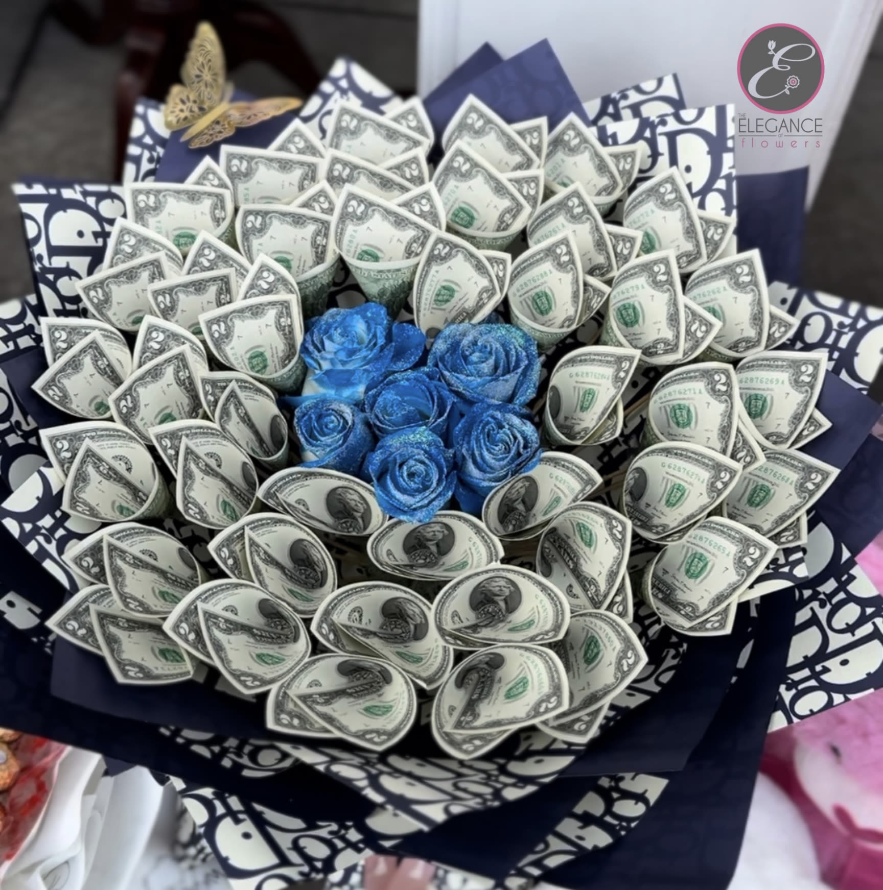 Money Bouquet #15 Money Bouquet #15 - Includes $2x 40 ($80), call for more information at 281-564-2600. Money bouquets are unique arrangements featuring dollar bills. They make a creative and luxurious gift for special occasions like birthdays, anniversary, or graduations, combining elegance with practicality.
