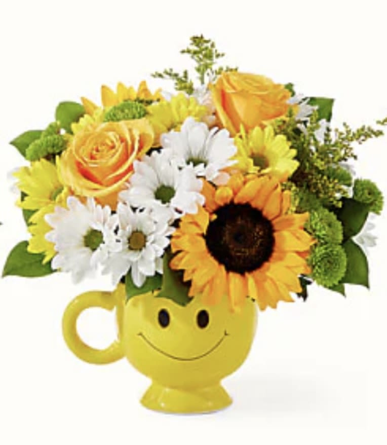 Bee Happy Bouquet Bee Happy Bouquet - Put a smile on their face with this mug of sunny blooms! Details For long–lasting blooms, replace the water daily. We suggest trimming the stems every couple days. Pet Safety Precautions: This bouquet or plant may include flowers and foliage that are known to be toxic to pets. To keep them safe, be sure to keep this arrangement out of your pet's reach.