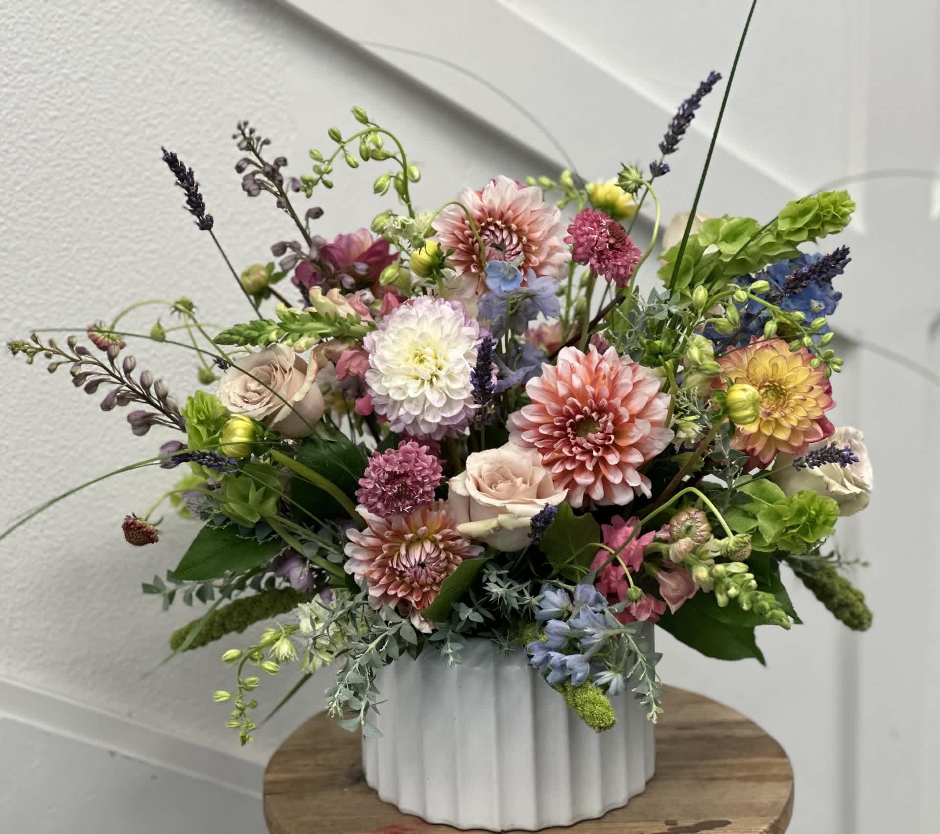 Dahlias by Kayla Dahlias by Kayla - This delicious Dahlia focused collection made by our Fresno designer Kayla is fabulous! The Colors and additional flowers will be chosen based on the freshest selection in stock that day. This is a season to behold!