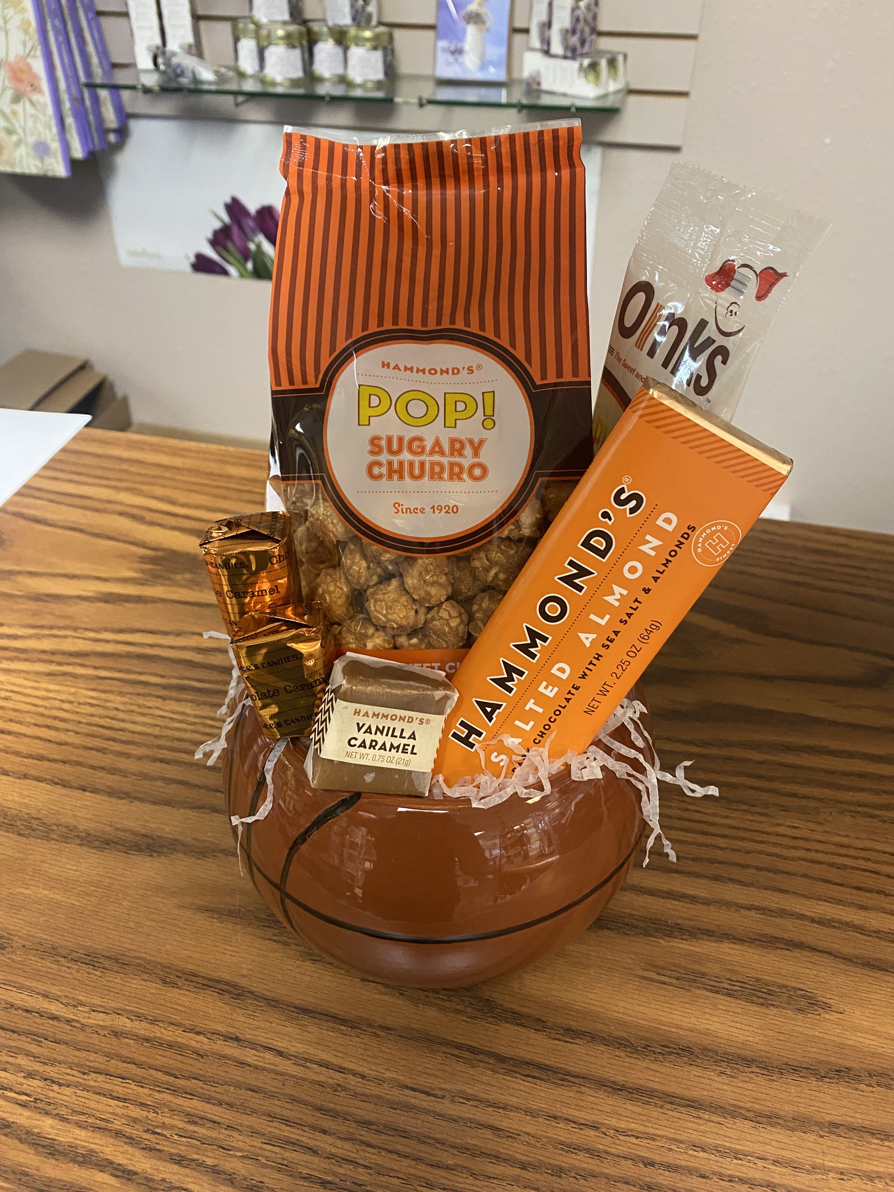 Basketball Enthusiast Basketball Enthusiast - The Basketball Enthusiast Includes: 1 Basketball Container, 1 Hammond's Sugary Churro Popcorn (great for a game!), 1 Spicy Chocolate Covered Bacon, 1 Hammond's Salted Almond Chocolate Bar, 1 Hammond's Vanilla Caramel, and 2 Chocolate Caramel See's Suckers
