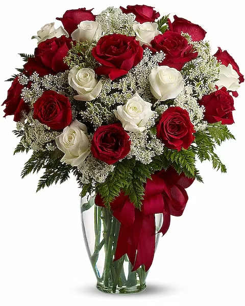 Love's Divine Bouquet - Long Stemmed Roses - Love's divine, and roses are too. At almost two feet tall, this beautiful mix of red and white roses - accented with Queen Anne's Lace, and adorned with a bold red ribbon - is a timeless gift for your beloved.  Red and white roses accented with Queen Anne's lace and more are delivered in a glass vase accented with a red satin ribbon.