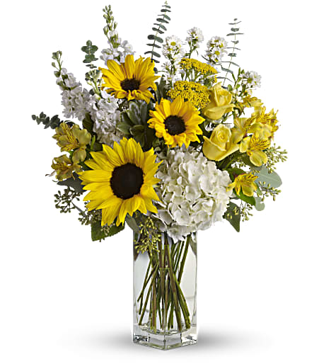 To See You Smile Bouquet To See You Smile Bouquet - Give them the biggest smile with these delightful flowers! Sunny sunflowers, happy hydrangea, and fragrant blooms make up this singularly spectacular bouquet. Approximately 18 inches wide and 23 inches tall.