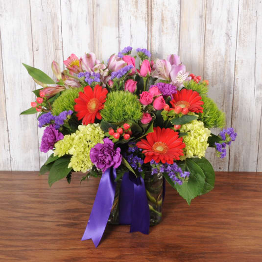 Color Pop Color Pop - Spring flowers make this floral arrangement pop with color.