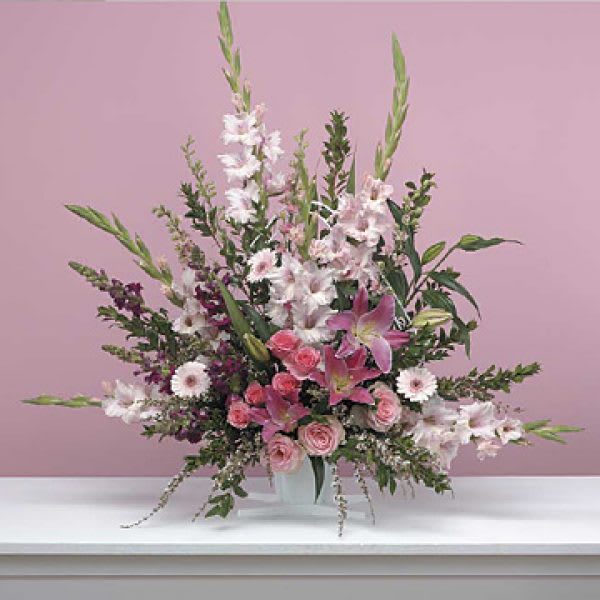Gentle Thoughts Gentle Thoughts - SKU: Funeral-73 This gentle arrangement is full of pink fresh flowers, designed with lilies, roses, snap dragons, gerbera daisies and gladiolus.