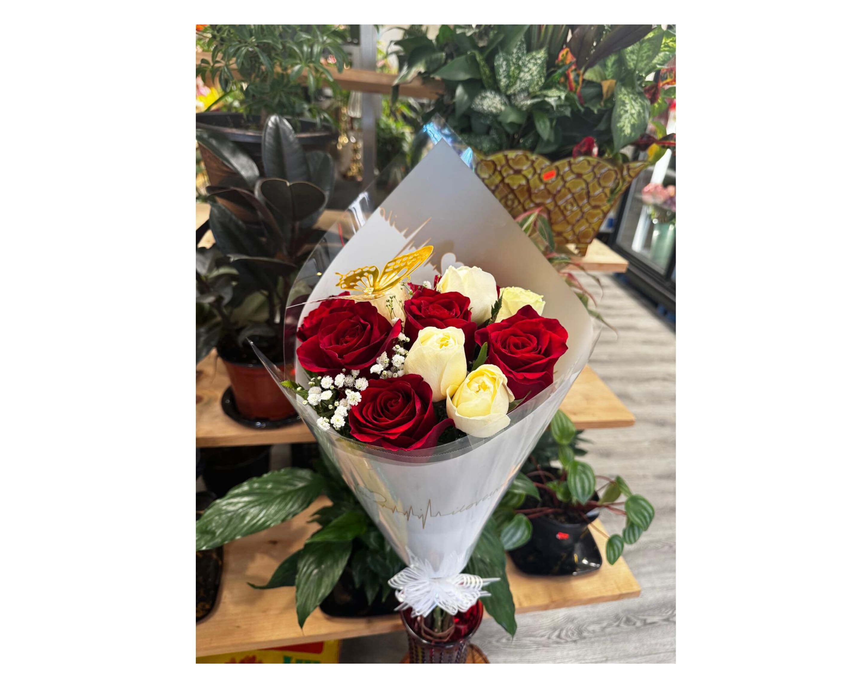 'Lover's Harmony' red roses with white roses Bouquet. - Bouquet  red and white roses with green foliage, wrapped in floral paper and bow. Perfect for giving an elegant gift.