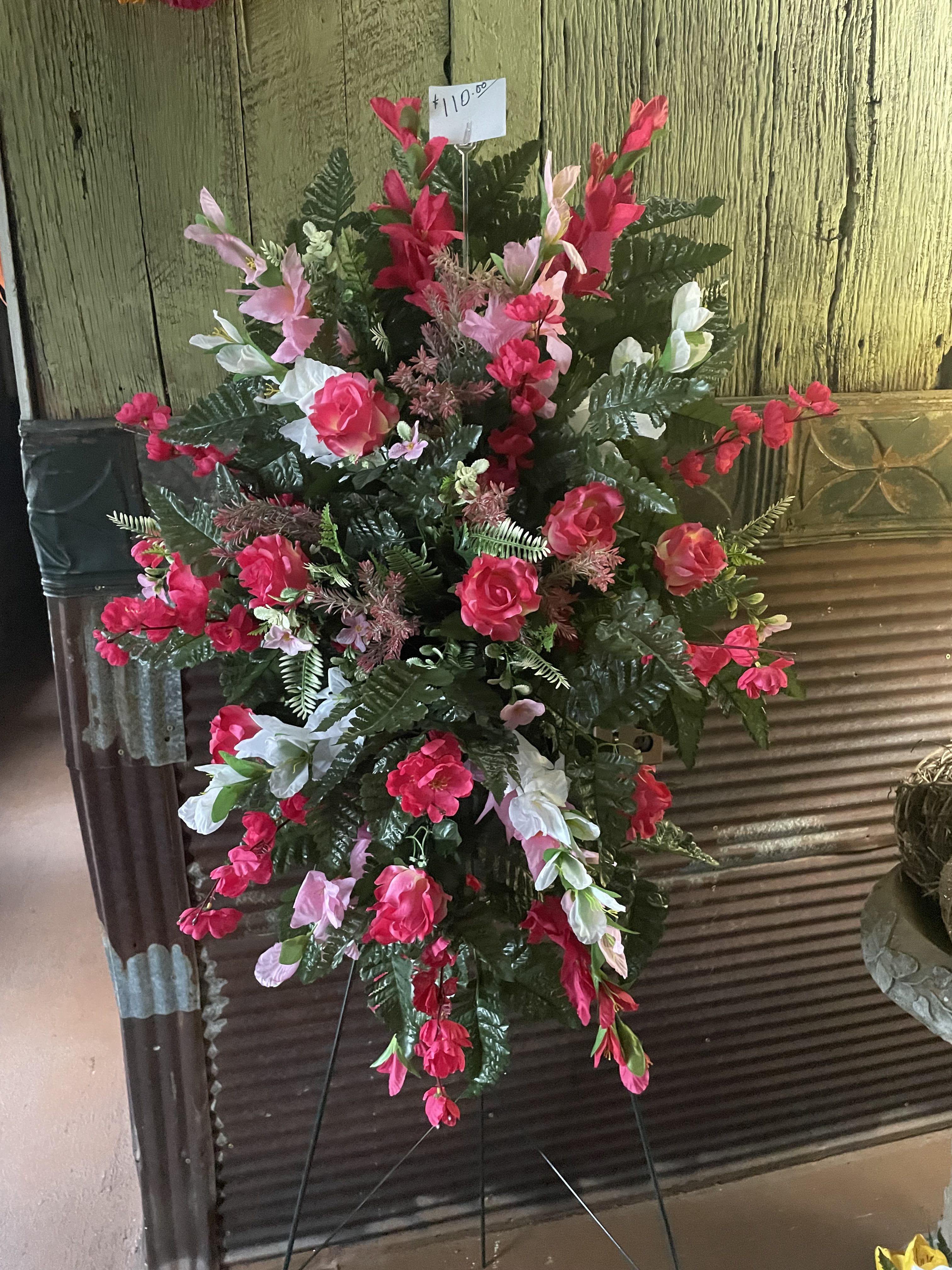 Pink and White Tribute Spray Pink and White Tribute Spray - Silk Standing Spray made of silk flowers & designed with a beloved in mind. A wonderful way to pay tribute to your loved one.