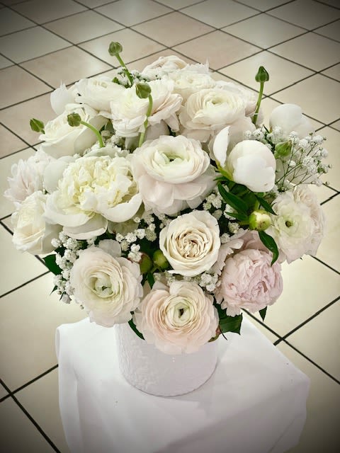 Lustful   - This bouquet shows that there is beauty in simplicity. Elegant perfect gift for almost any occasion, especially for celebrations, wedding or for Sympathy and showing gratitude.    Arrangement Details: Includes white roses, blush Ranunculus, blush Peonies, White Peonies with baby breath in a white elegant white Vase.    APPROXIMATE DIMENSIONS: Standard: 12&quot; H X 10&quot; W  Deluxe: 14&quot; H X 12&quot; W  premium:16&quot; H X 14&quot; W