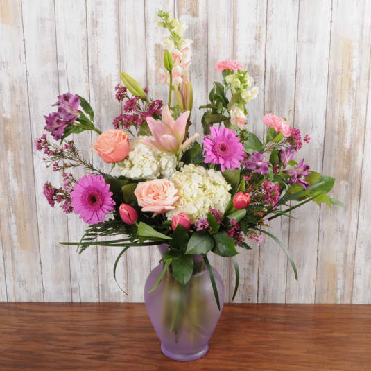 Pretty Pastels - This fresh arrangement is mixed with light pastel tones in a classic style urn vase. It is perfect to send for any occasion.