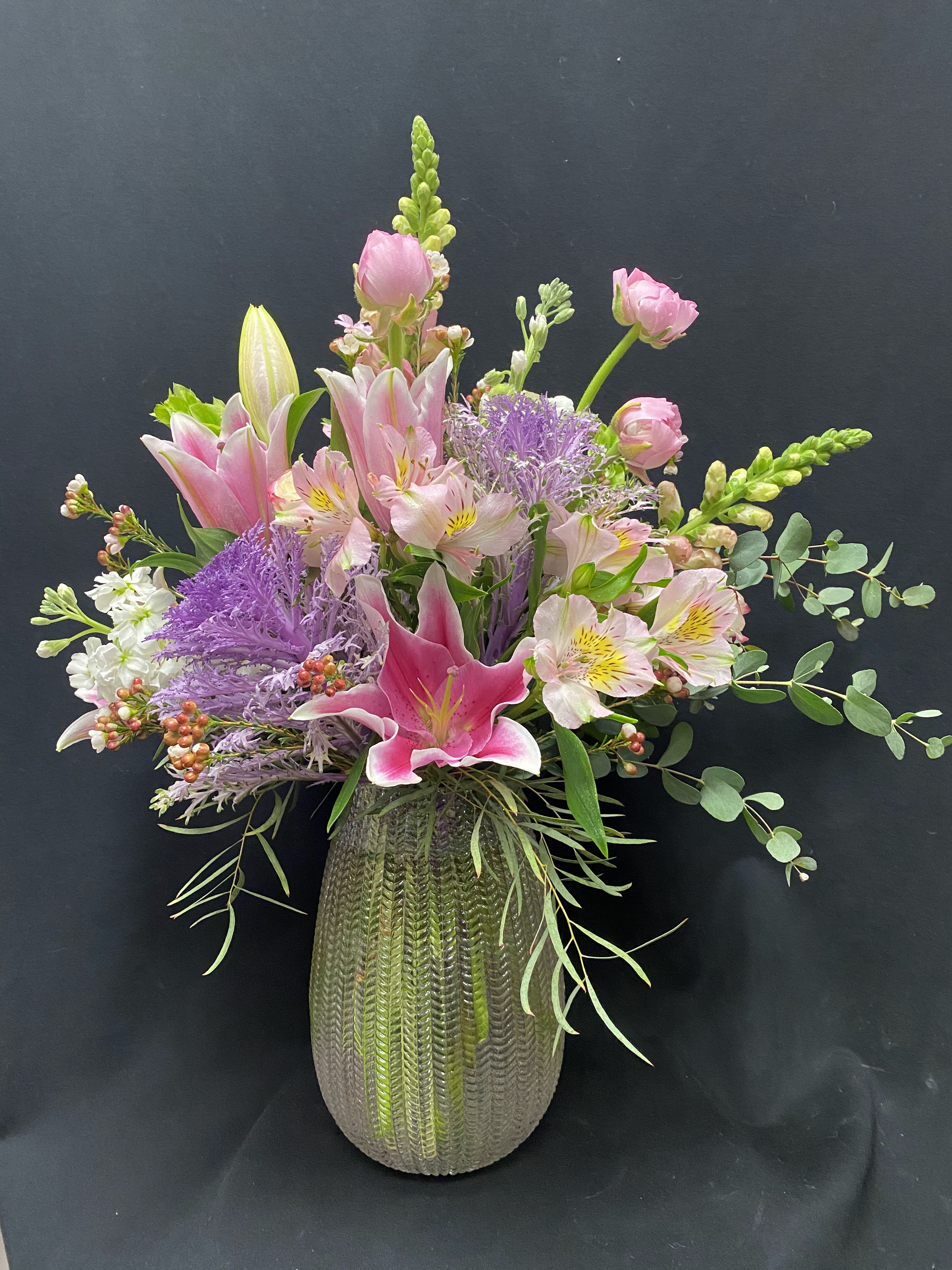 Bright sky  - vased mixture of pink stargazers, snsp dragons, stock, ornamental cabbage, ranaculus,  hypericum berries, wax flower, mixed eucaliptus.