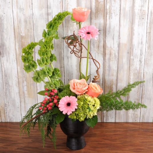 Enlightenment Enlightenment - Colorful blooms in a keepsake ceramic container.