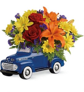 Vintage Ford Pickup Bouquet [T16F100A] - Vroom vroom! Get Dad's motor running this Father's Day with a freewheelin' gift he'll never forget - a bold bouquet of roses, lilies and mums, hand-delivered in a '48 Ford Pickup. Hand-painted in classic blue, this ceramic collectible is one-of-a-kind, just like Dad.  This little pickup includes red roses, orange asiatic lilies, yellow daisy spray chrysanthemums, purple sinuata statice, and leatherleaf fern. Delivered in a '48 Ford Pickup collectible keepsake.  Approximately 13 1/2&quot; W x 11&quot; H  Orientation: One-Sided      As Shown : T16F100A