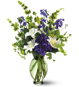Green Inspiration Bouquet [07R120B] - Someone with great taste is having a birthday and you want to send a floral gift they'll appreciate. This stunning arrangement of white and purple flowers in a delicate green vase couldn't be more perfect.  Arrangement includes blue hydrangea, white Asiatic lilies, dark blue delphinium, bupleurum and Bells of Ireland accented with assorted greenery.  Delivered in a graceful light green glass vase. Bouquet is approximately ”13 W X 18” H.  Orientation: One-Sided      As Shown : 07R120B  