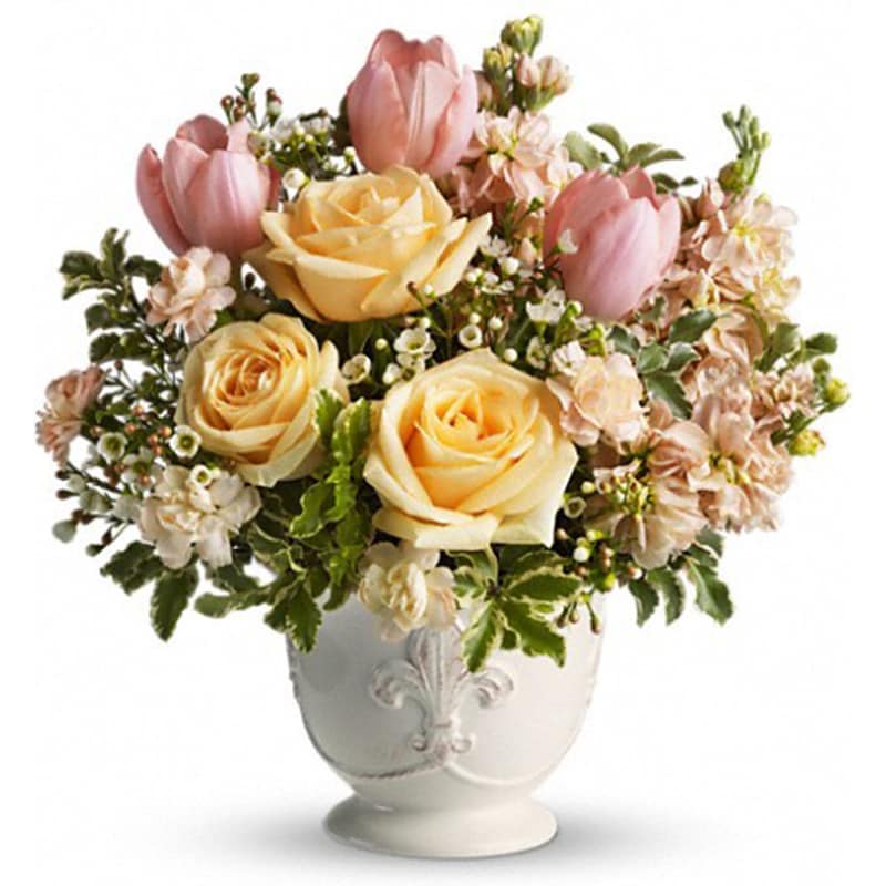 Peaches and Dreams [T145-3A] - The only thing sweeter than peaches and cream just might be this dreamy bouquet of delicious roses and tulips. Be a peach and send one today!  Pretty in peach roses, tulips, miniature carnations and stock along with white waxflower and fresh spring greens are beautifully arranged in a ceramic French country container.  Approximately 12 1/2&quot; W x 13&quot; H  Orientation: All-Around      As Shown : T145-3A
