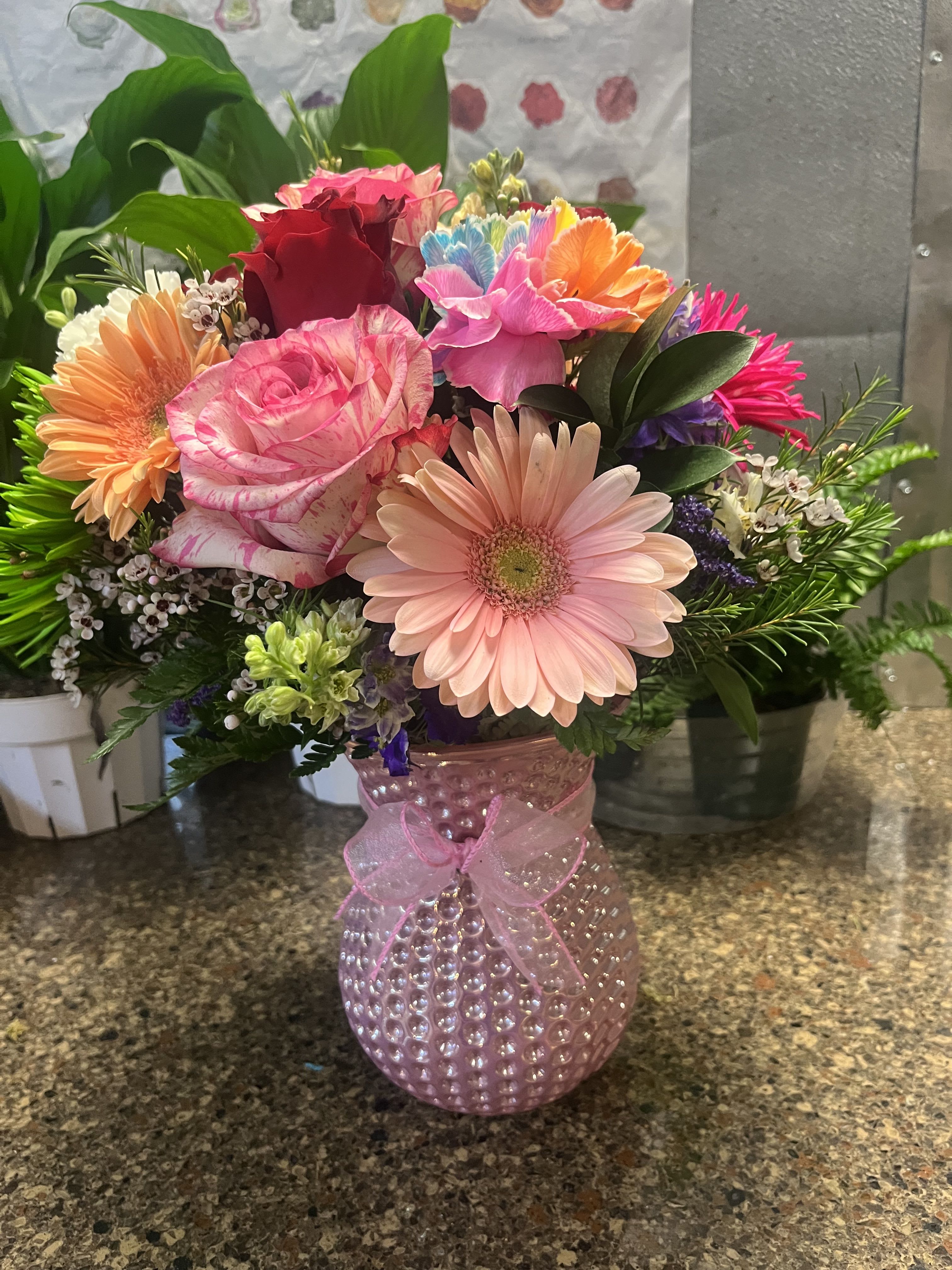 Colorful pink  - fresh Gerbers  , roses , carnations , daysis  , lemon leaves , wax 