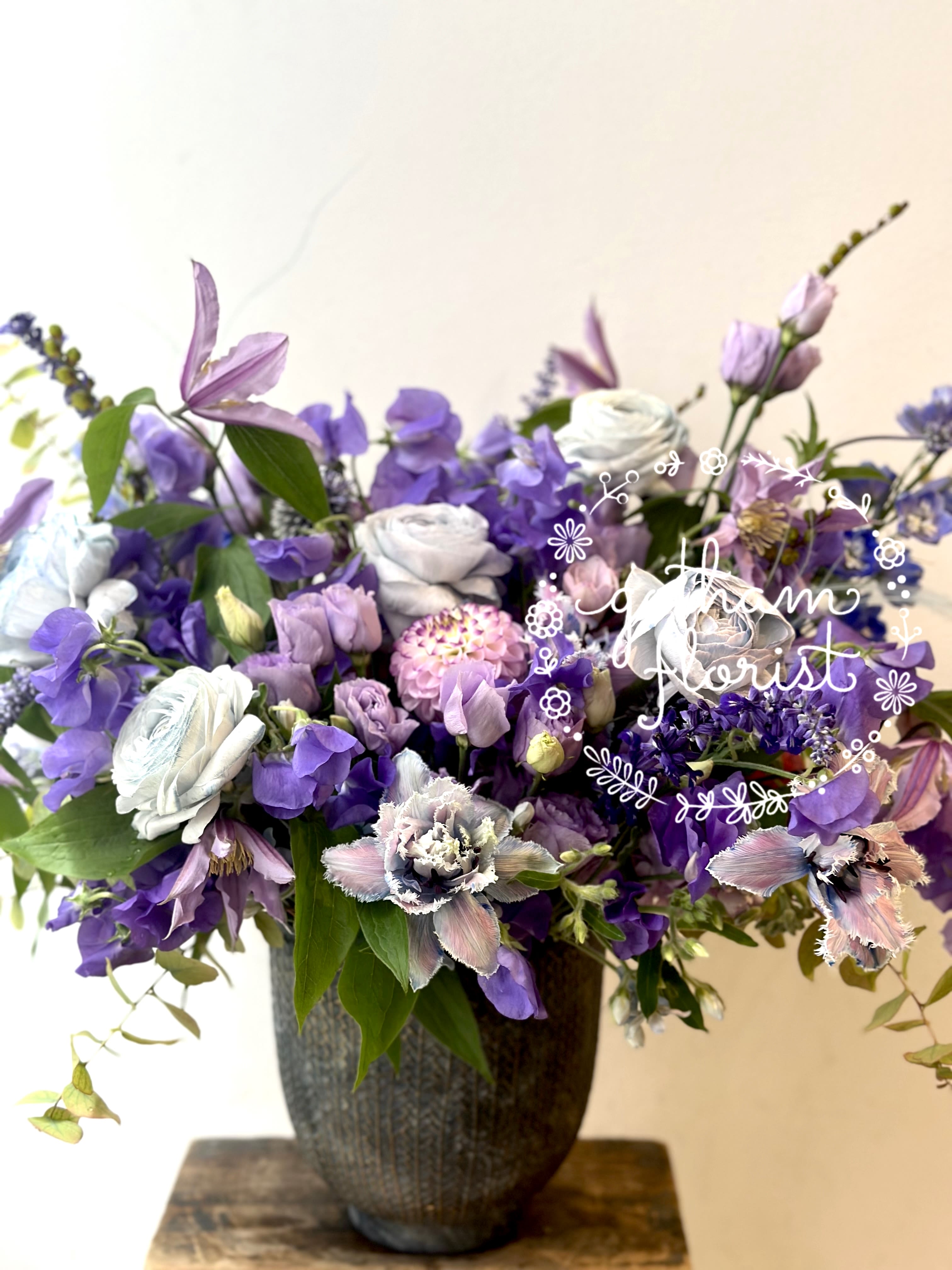 A Whole New World - Our enchanting Whimsical Design, brimming with an exquisite selection of seasonal flowers. Imagine Anemones dancing with ranunculus, Roses, and fragrant Sweet Pea, subtly accented with luscious lisianthus and delicate foliage. This artfully curated arrangement transforms any room into a vibrant celebration of nature’s beauty. Each bloom is chosen for its peak freshness and visual harmony, ensuring that your vase is a radiant focal point. Perfect for gifting or a luxurious self-indulgence, this stunning bouquet transcends mere decor to become a statement of taste and elegance. Immerse yourself in the splendor of natural artistry—make every moment extraordinary with our signature design. We deliver same day to manhattan, Brooklyn, West Chester and Conneticut. 