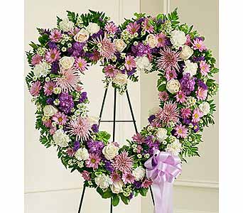 Lavender and White Open Heart Lavender and White Open Heart - Lavender and white flowers such as roses, stock, carnations and more. Convey your deepest condolences and undying love with this beautiful arrangement. As Shown : HUD-91245
