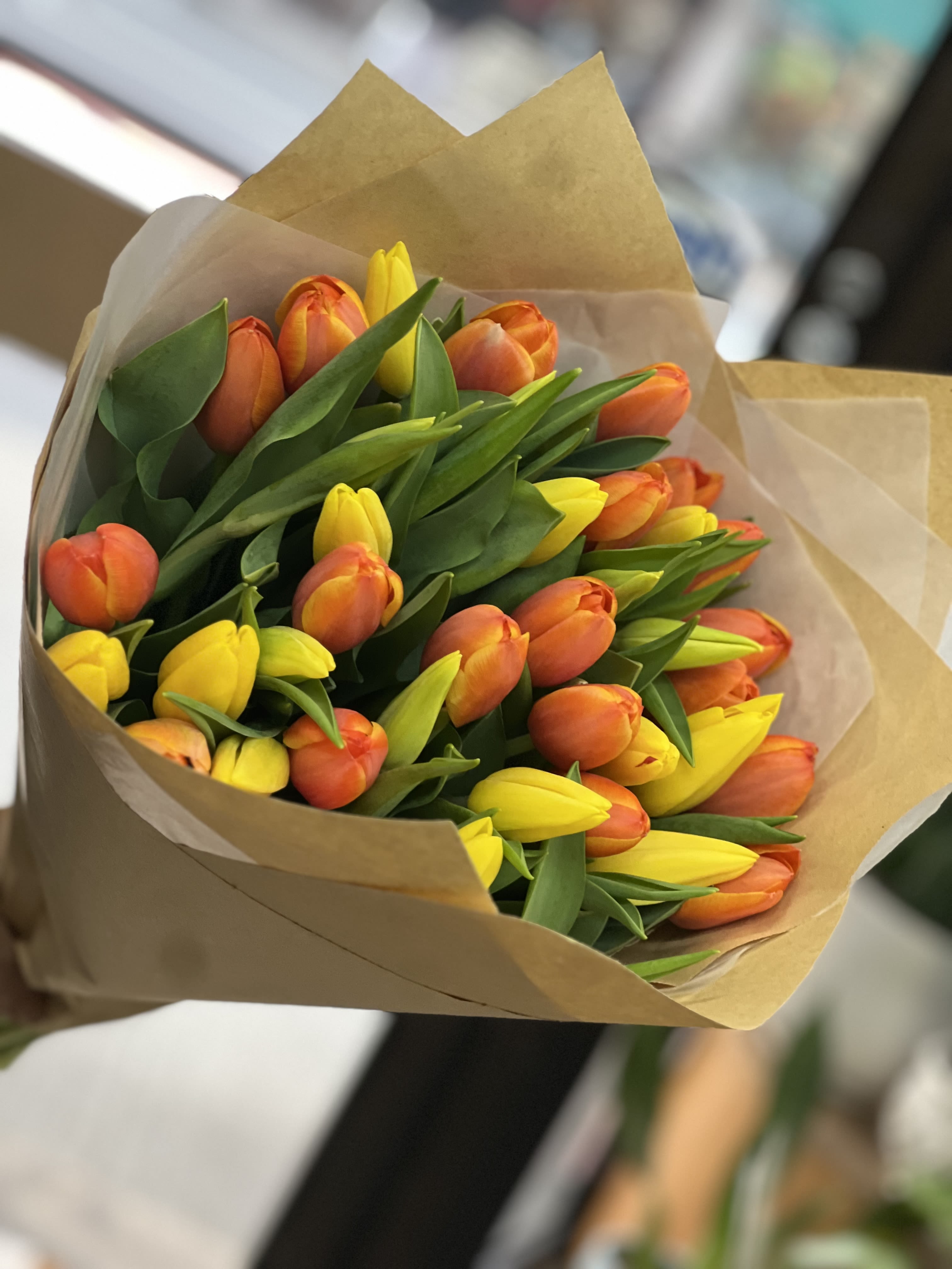 Heart Ablaze - This beautiful loose bouquet of tulips is a perfect blend of being yellow with orange ready to brighten anyone’s day ! Please note: Vase not included. 