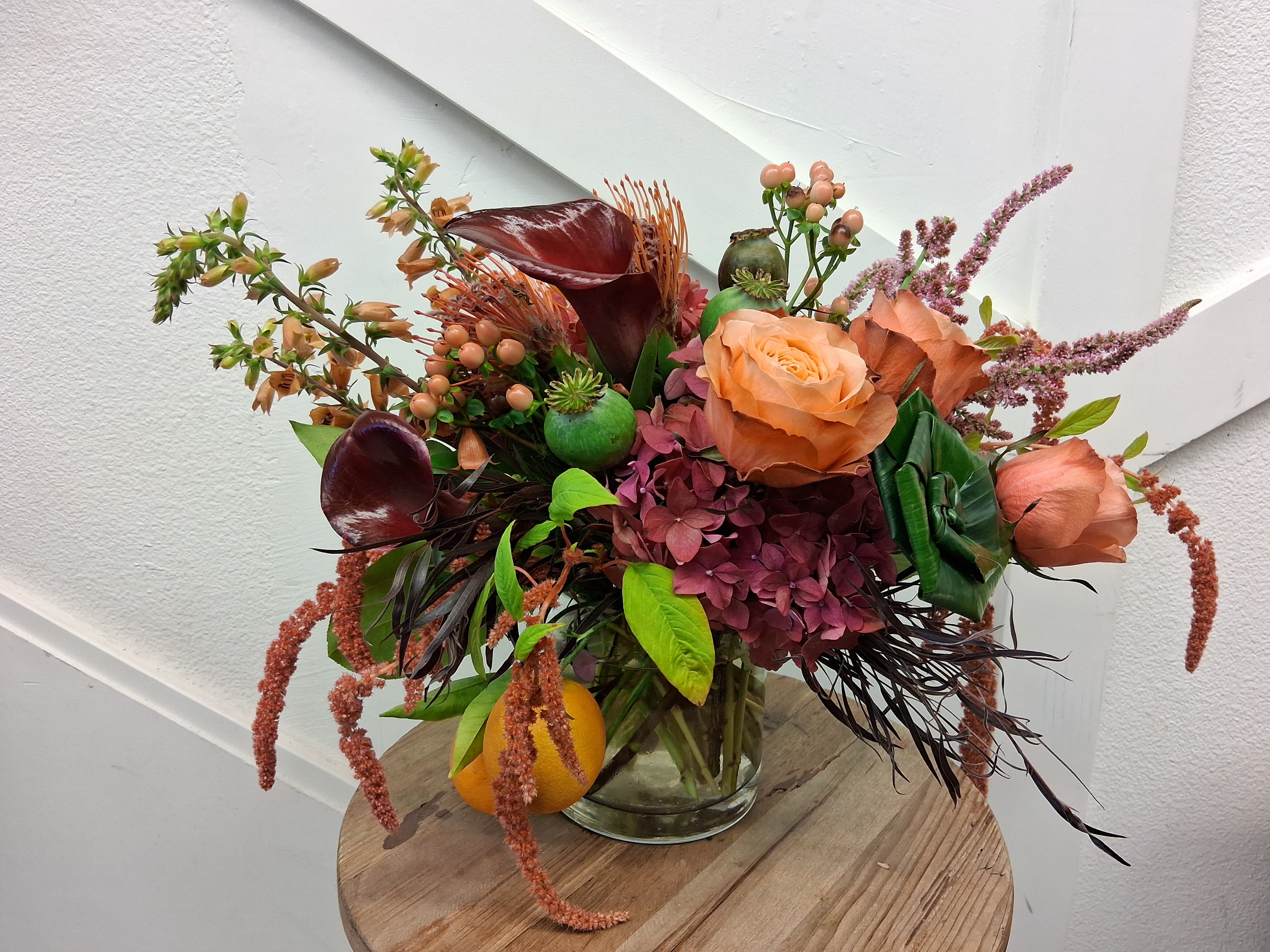 California at Sunset - The abundance of the california sky during a summer sunset all arranged in a compact yet full look.  The premium florals used will have them left in awe like the first star at dusk, as the suns rays dance in a pink and orange array of color. 