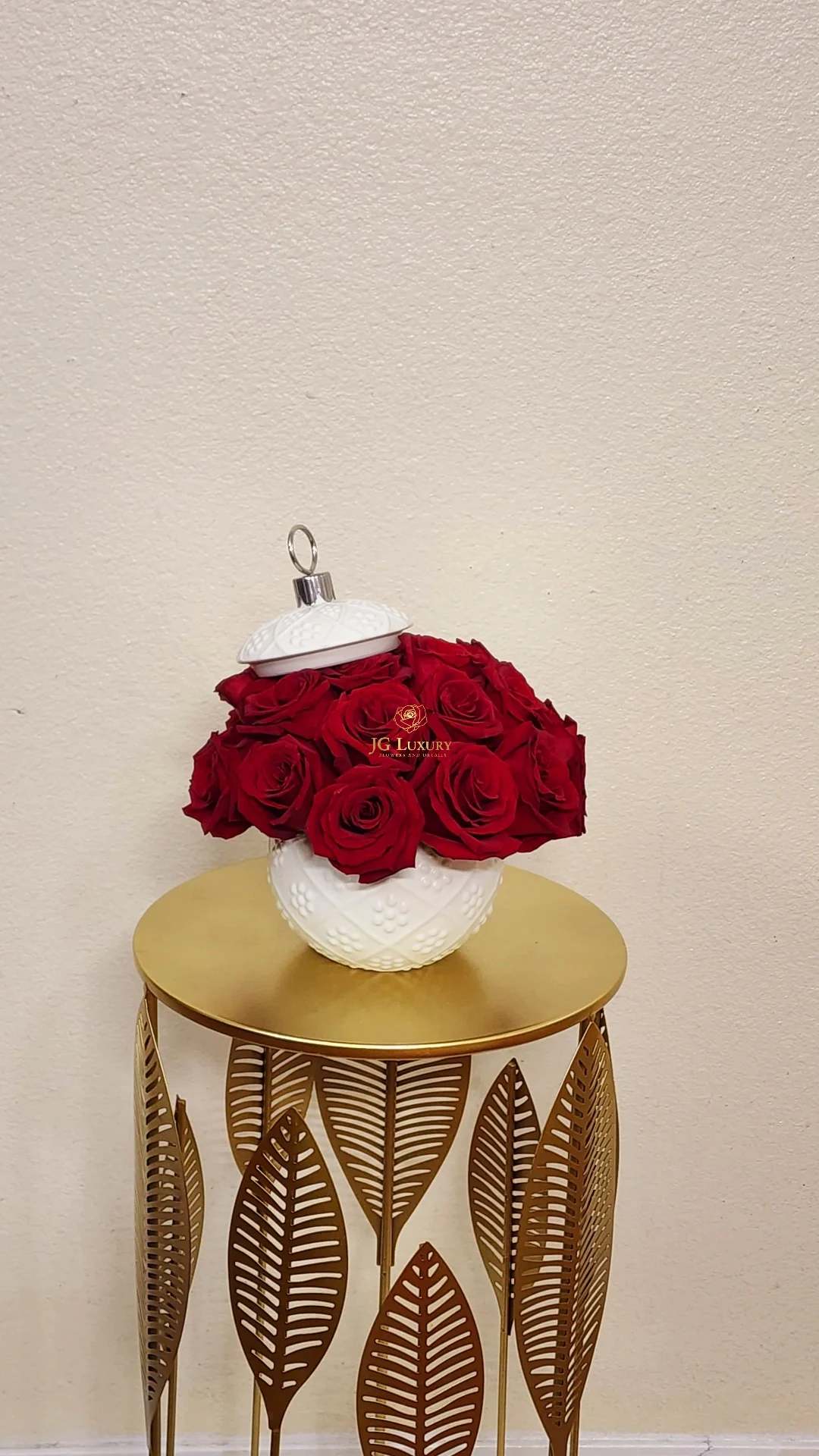 Rose Bell - Charming arrangement of red roses in an unique container.