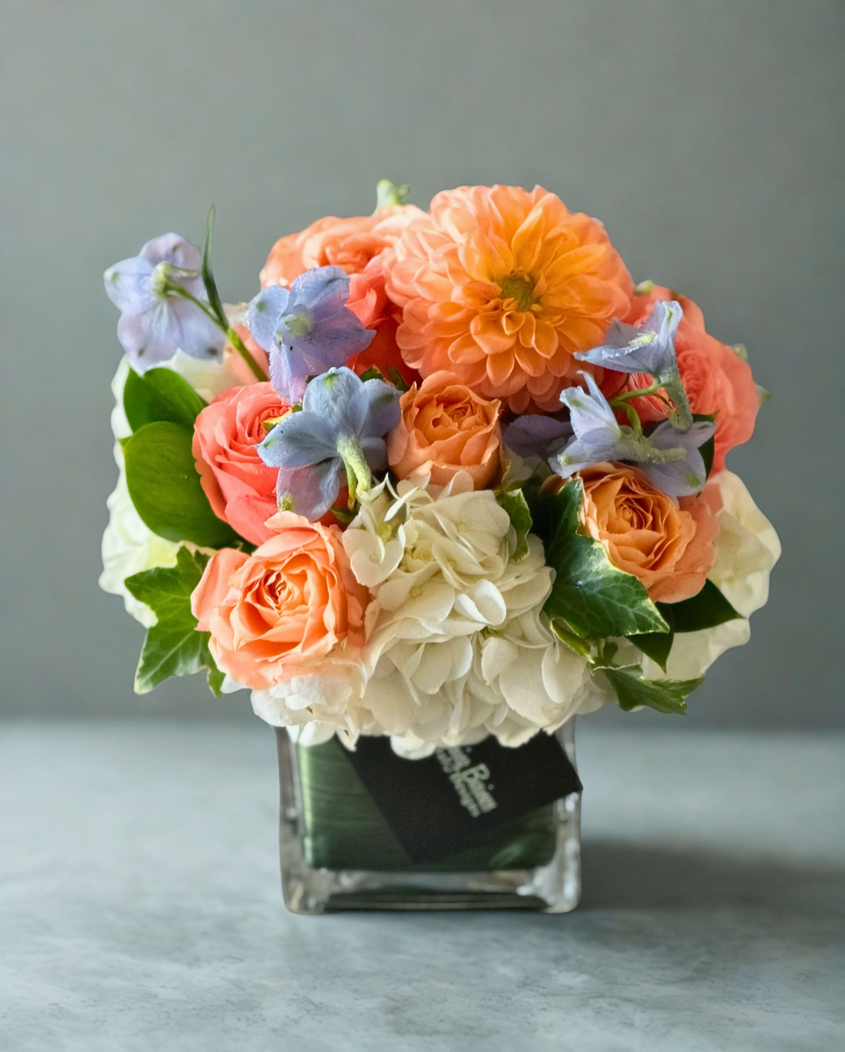 Dottie Arrangement – by My Blooming Business - Dottie Arrangement – by My Blooming Business Soft, elegant, and effortlessly charming, the Dottie Arrangement is designed to make a lasting impression. Featuring a delicate palette of peach and white florals, this arrangement exudes warmth and grace. Thoughtfully accented with a touch of soft blue, Dottie brings just the right amount of contrast for a look that’s fresh, refined, and unforgettable.  Whether you’re sending love, celebrating a special moment, or simply brightening someone’s day, Dottie has all your bases covered.  Expertly crafted by My Blooming Business, a top-rated florist in Los Angeles, with 5-star reviews on Google and Yelp. We proudly deliver throughout Los Angeles, the San Fernando Valley, and the San Gabriel Valley.