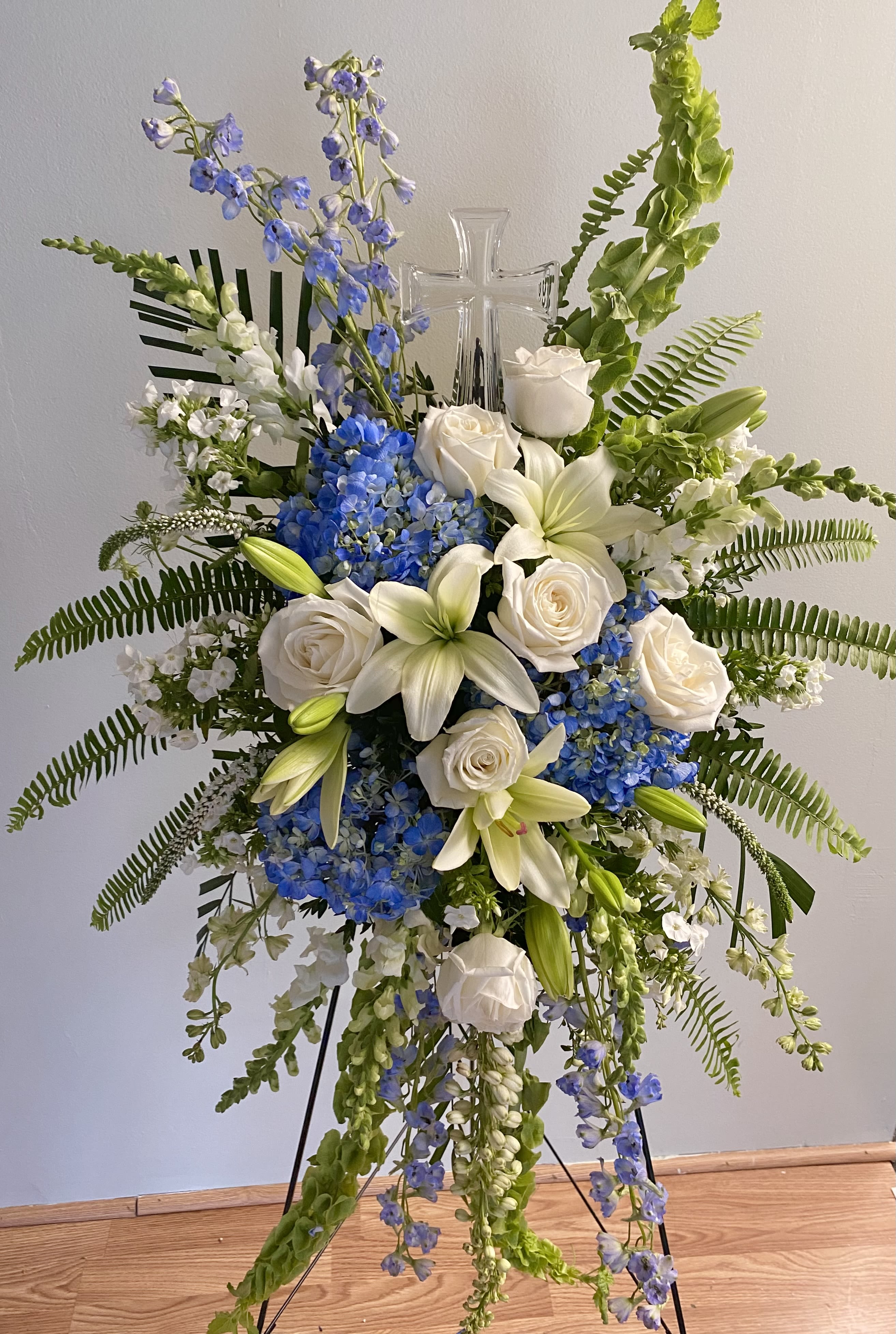 Crystal Sky Spray - A crystal cross sits beautifully between shades of blues and whites in this beautiful spray