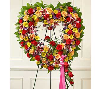Bright Standing Open Heart Bright Standing Open Heart - When words aren't enough to express your sympathy and love, this open heart standing spray of bright blooms conveys your condolences beautifully. As Shown : HUD-91387