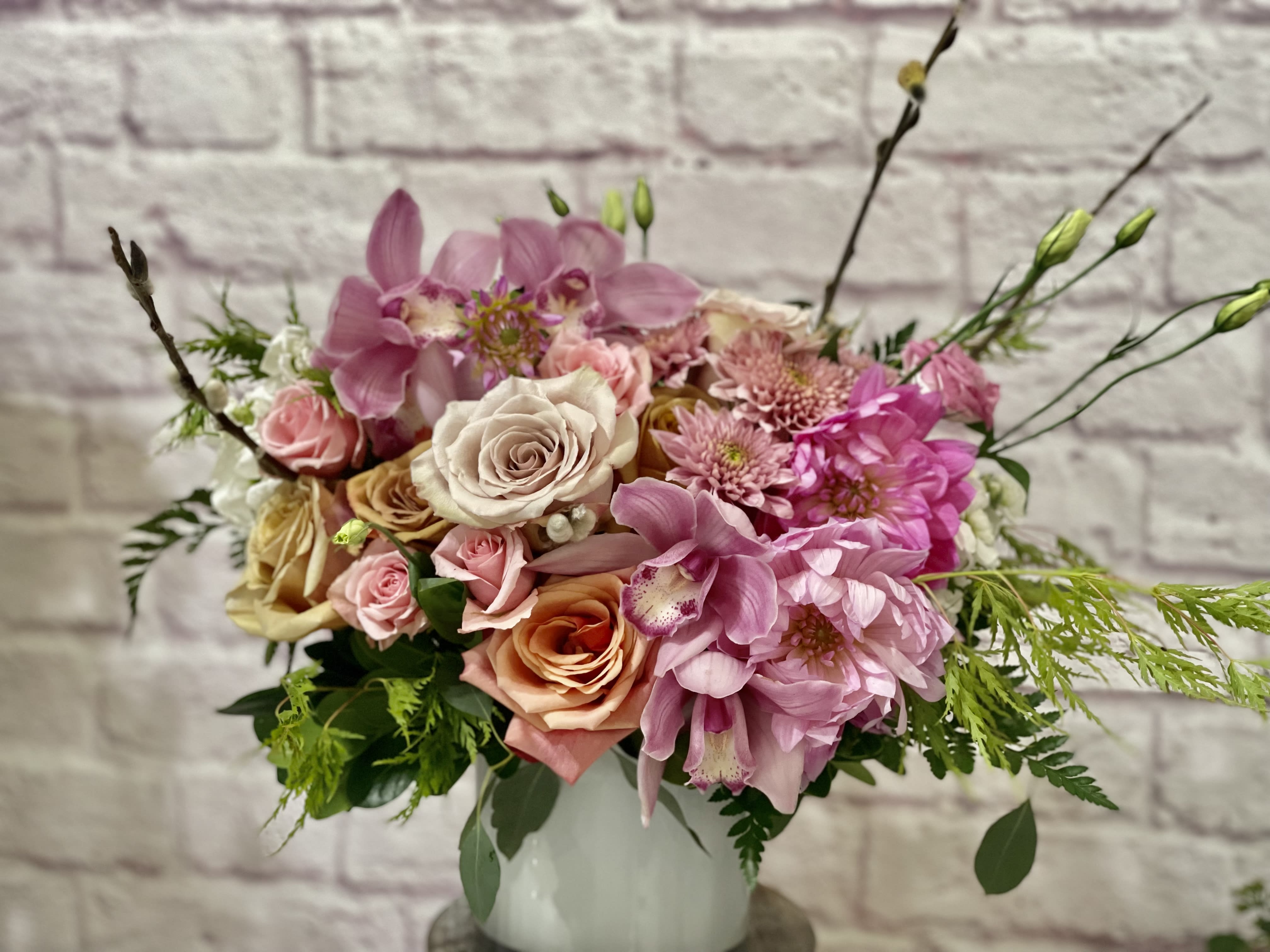 Bambina Bambina - Soft colors, unique flowers and bold shapes. A luxurious bouquet that strikes the perfect balance of soft and bold beauty. Artfully arranged in a quality white vase. A real stunner! Perfect flowers for birthdays, "get well soon," new baby, sympathy, romantic gestures, and "Thank you." Also a beautiful wedding palette. Available for delivery in Seattle, Bellevue, Shoreline, and surrounding areas. Available for delivery in all neighborhoods in Seattle including Magnolia, Ballard, Fremont, Downtown, Queen Anne, Crown Hill, U District, West Seattle, International District, Capitol Hill, Pioneer Square, Beacon Hill, Columbia City, Georgetown, etc.