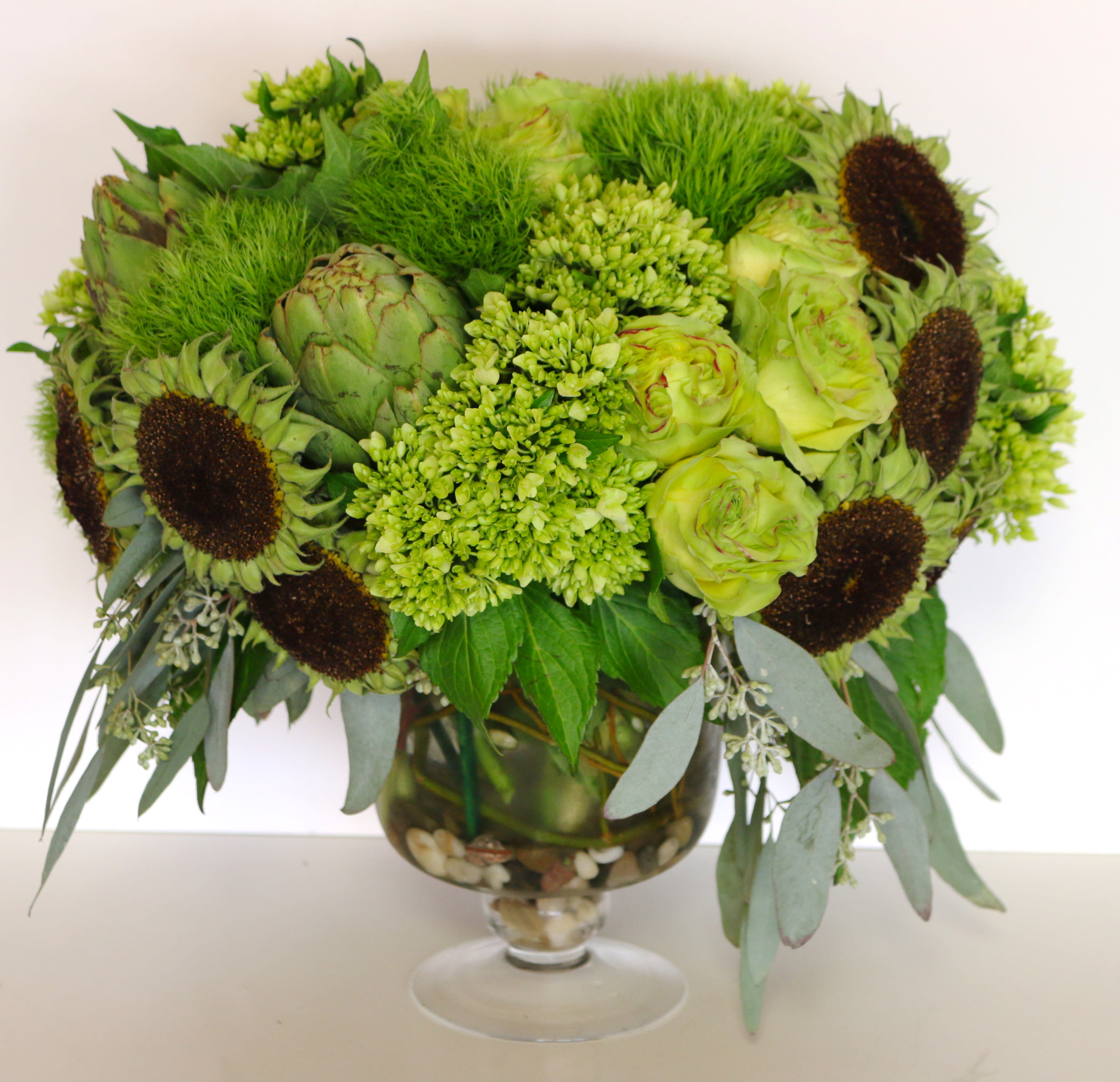 Verde Verde - Bowl of green seasonal blooms with assorted pods or naked sunfloe centers.