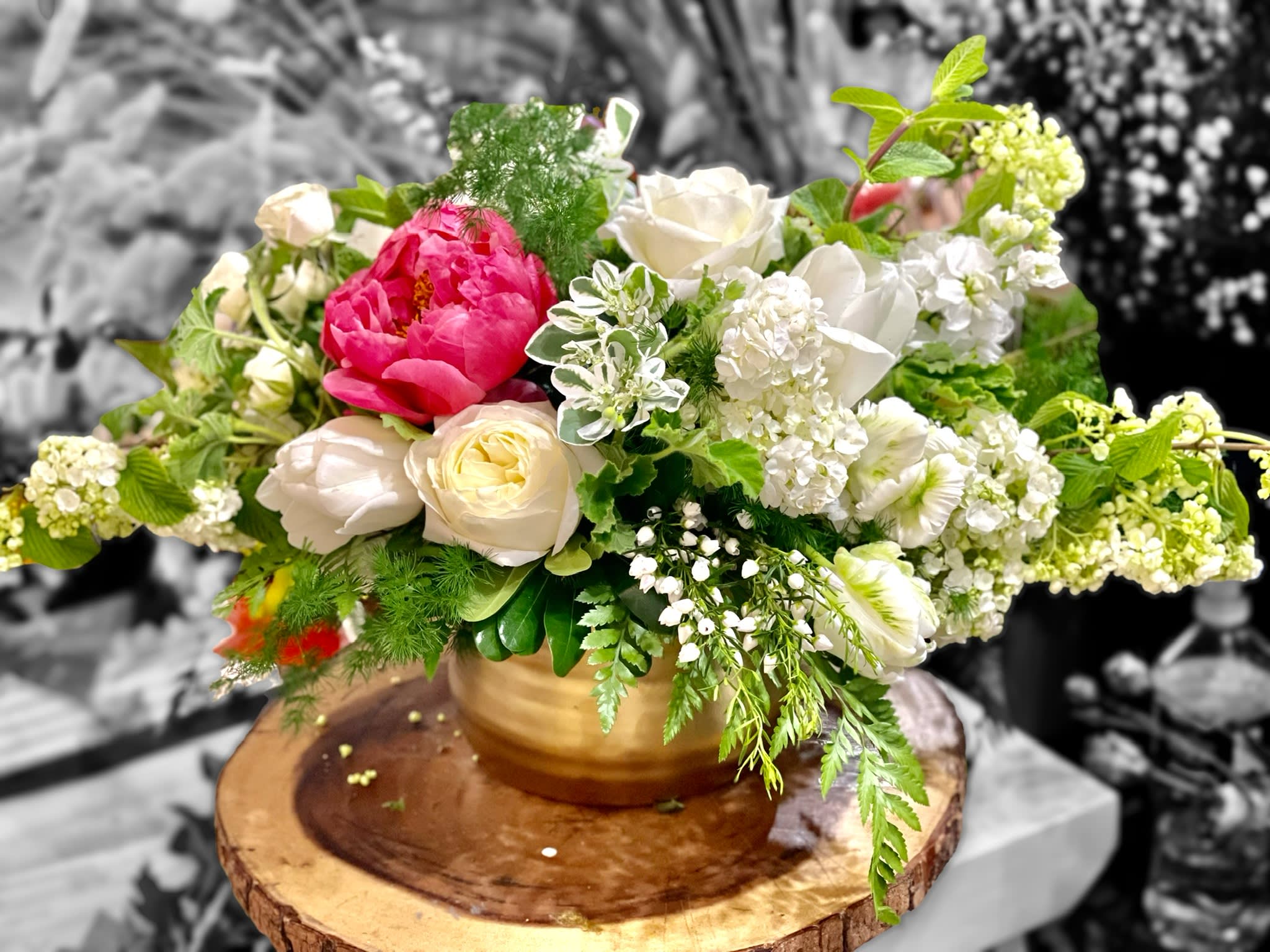 Glamour and a Hint of Glitz Glamour and a Hint of Glitz - This stunningly chic fresh floral bouquet is a medley on tone on tone whites and greens with just a pop of vibrant color provided by peonies! Arranged in a high quality gold ceramic vase.