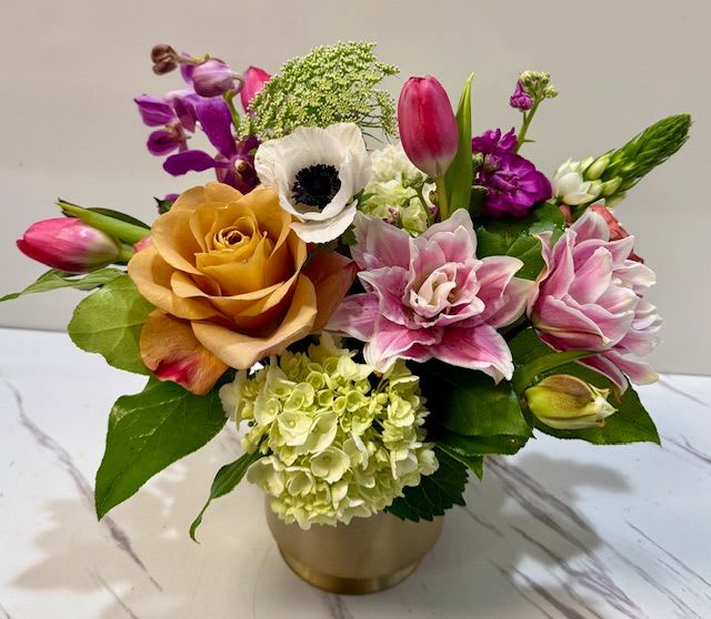 Precious Petals  - A stunning blend of unique, elegant blooms thoughtfully arranged to create a truly gorgeous display. Featuring a curated mix of seasonal flowers, each stem is chosen for its beauty and charm, resulting in a refined yet eye-catching design that feels both delicate and luxurious.