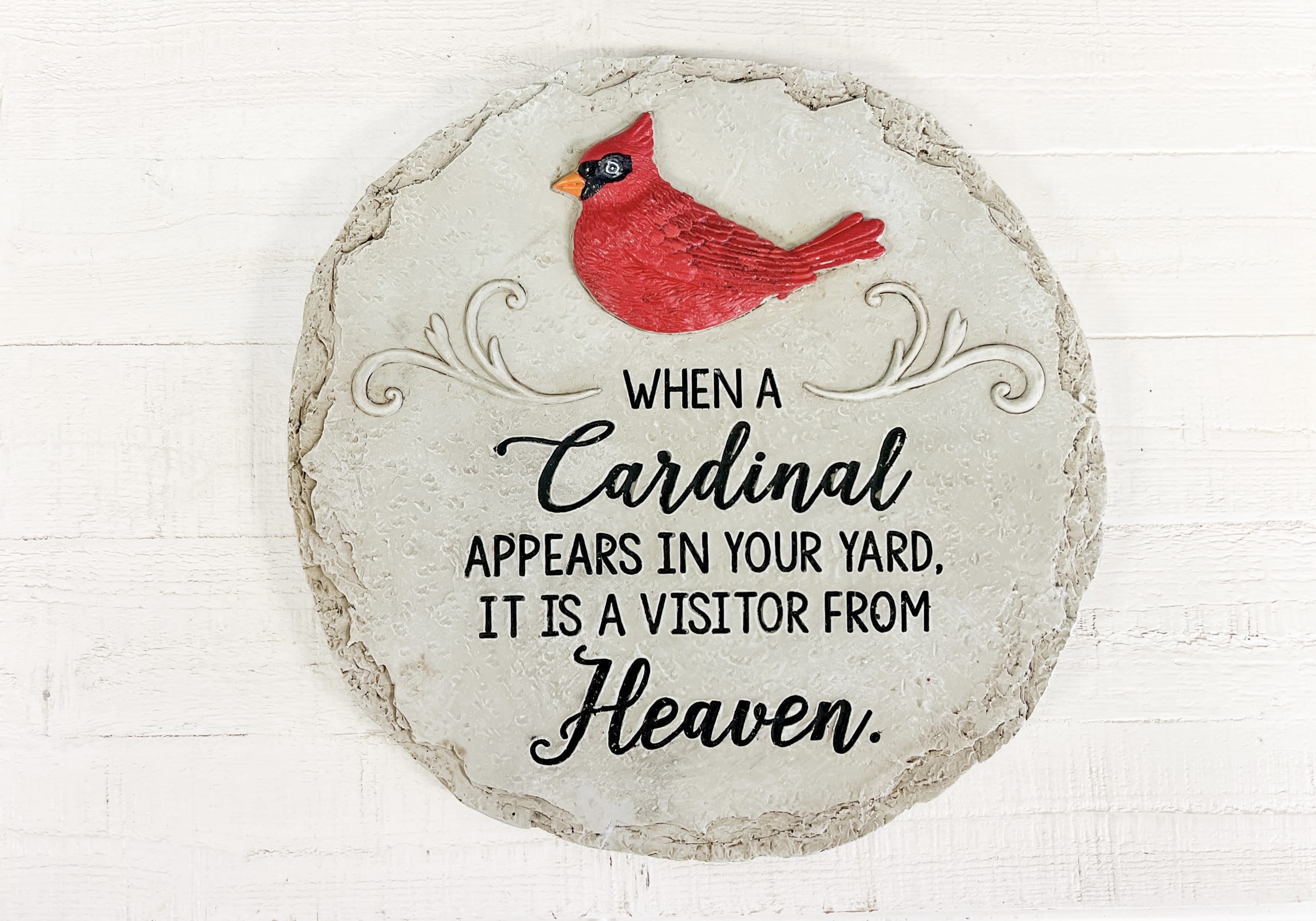 When a Cardinal Appears Steppingstone  - Bring comfort and peace to any garden or memorial space with our “When a Cardinal Appears” Stepping Stone. Crafted with a natural stone look and featuring a vivid red cardinal, this decorative piece reads: “When a Cardinal appears in your yard, it is a visitor from Heaven.” A meaningful gift for remembrance, sympathy, or spiritual encouragement. 	•	Suitable for indoor or outdoor display 	•	Makes a thoughtful add-on to floral deliveries or memorial arrangements