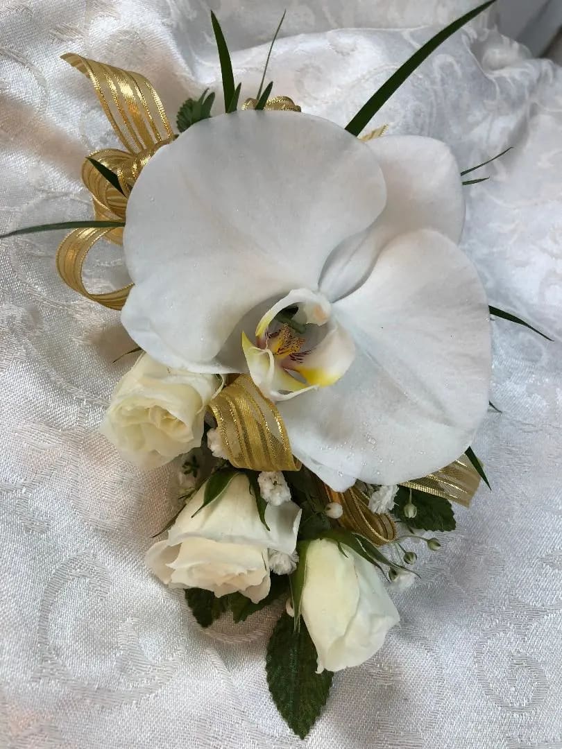 Cymbidium Orchid &amp; Spray Roses Wristlet (Must Be Ordered Three Days In Advance) - Philaenopsis Orchid,  Spray Roses, Ribbon, Greens.  Specify Spray Rose Color if available.  Color of dress can be added to Special Instructions for Ribbon Choice ( As Close as possible) Call  908-234-2900  for assistance.