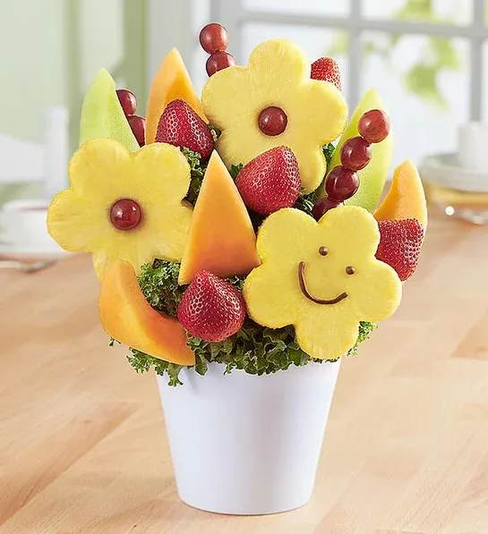 Your Best Smile Eddible Bouquet  - This fruit-filled sensation will have them smiling from ear to ear! Loaded with plump, dipped strawberries, mouthwatering melon and the happiest daisy-shaped pineapples around, it’s got all the right ingredients for celebrating a special day, lifting somebody’s spirits…or savoring for yourself.