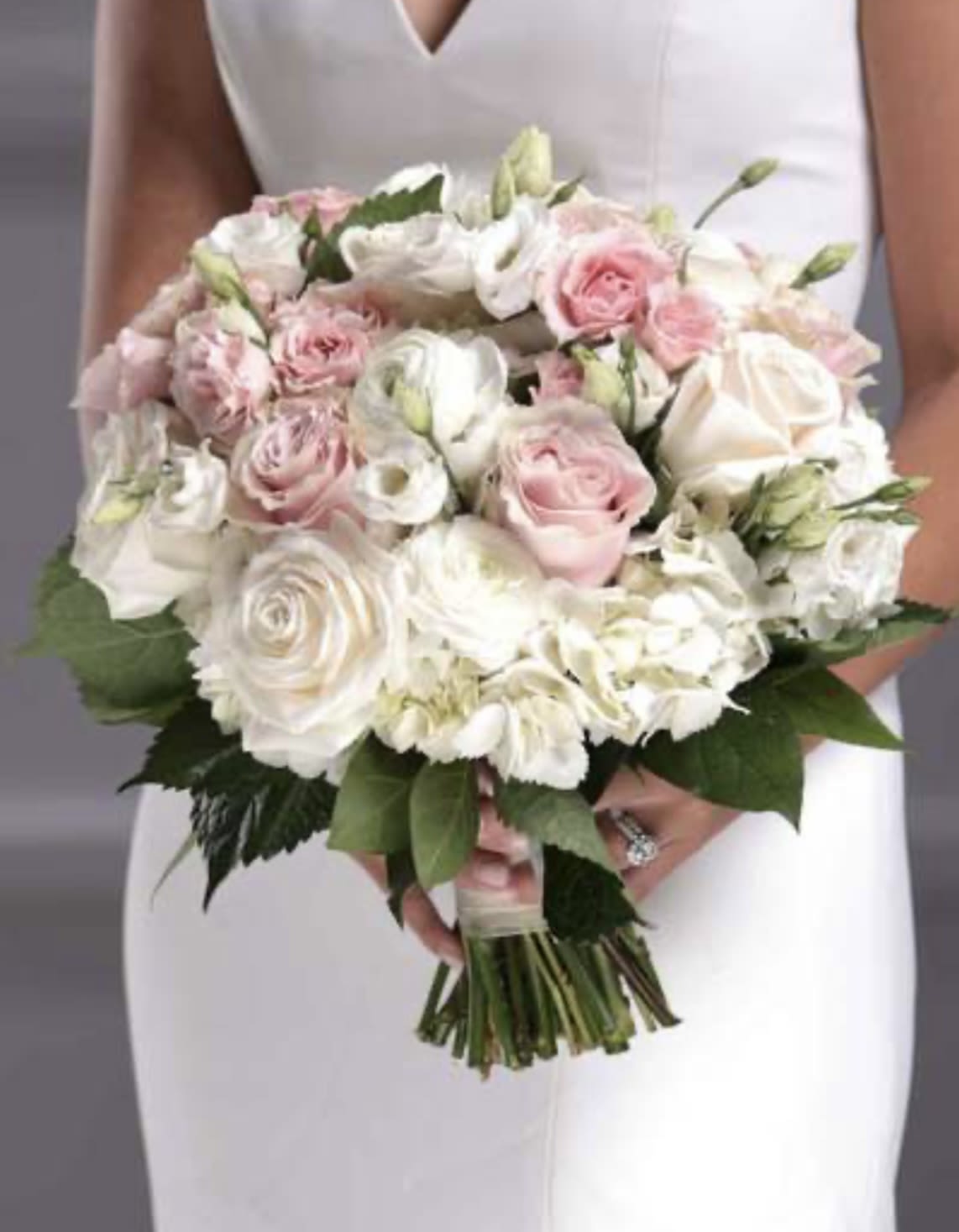 Soft pinks and whites handheld bridal bouquet Soft pinks and whites handheld bridal bouquet - white hydrangea, white roses, pink spray roses, pink standard roses, white lisianthus, greens hand tied with ribbon large bouquet