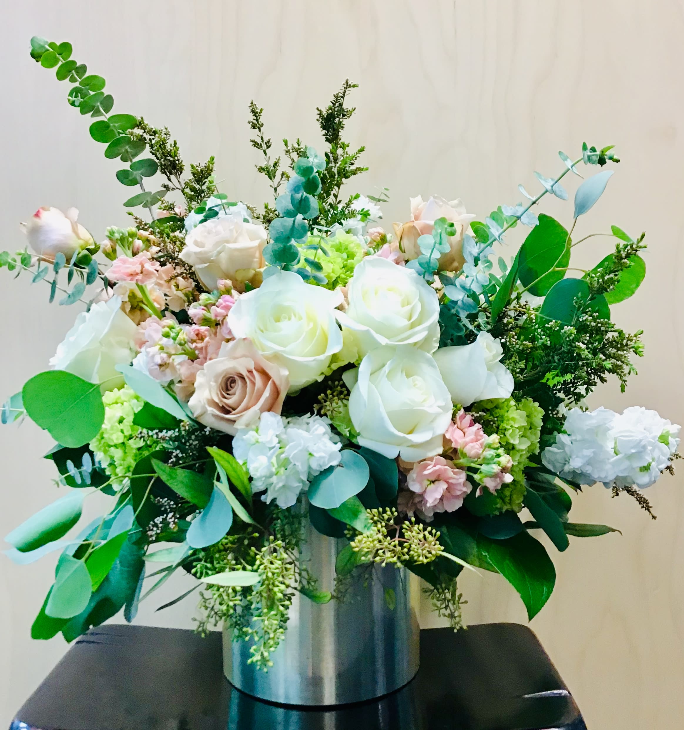 Gone Too Soon Gone Too Soon - Show compassion and support for someone who has lost a loved one by sending this floral arrangement full of roses, hydrangeas, fragrant stock, seeded and spiral eucalyptus as well as other season greens and flowers. Colors shown are blush and white, but other colors are available upon request.